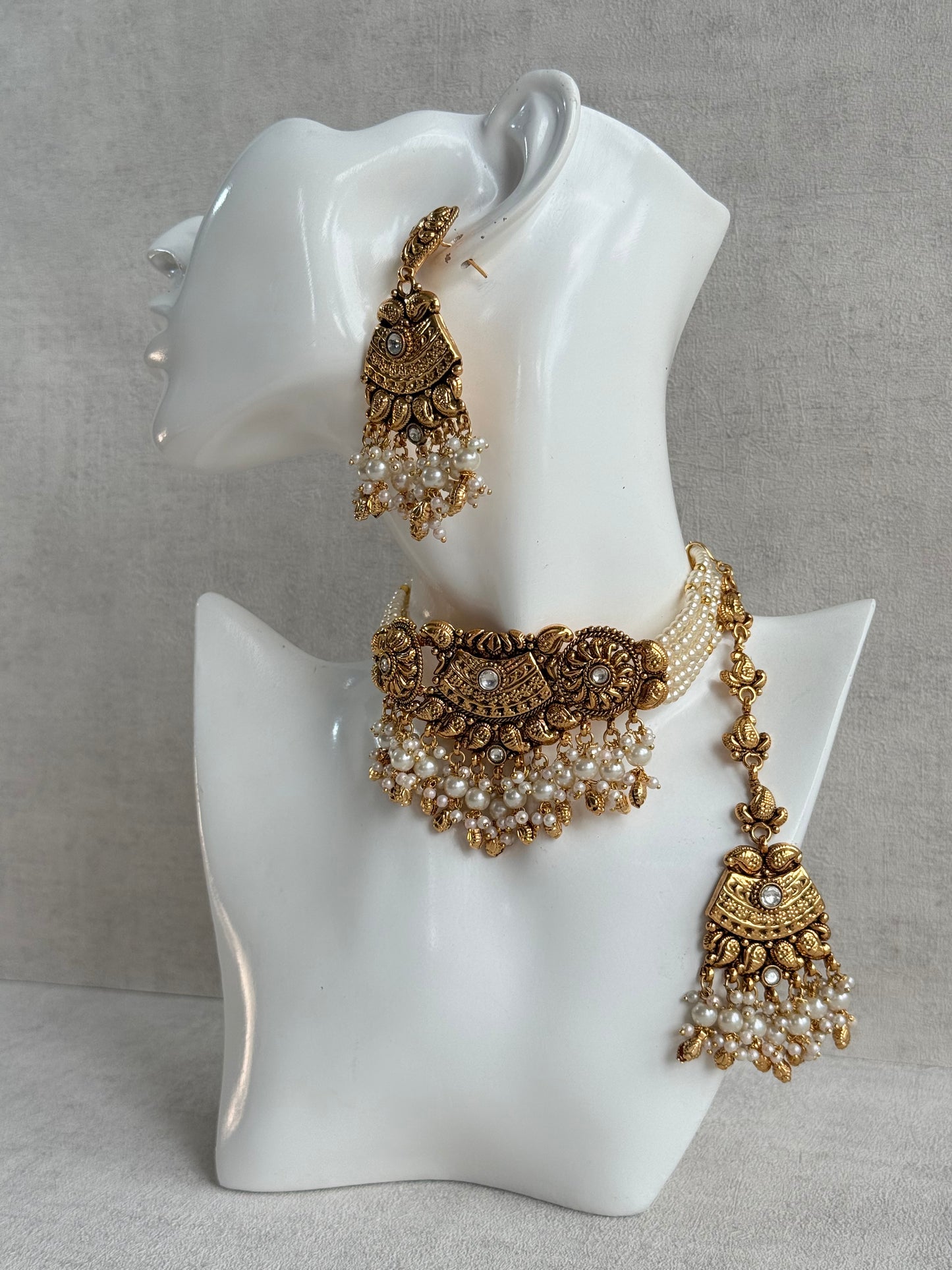 Ayura Designs Sairish Choker Set with Earrings & Tikka – Ivory Beads, Pearl Detailing, Ghungroos, Paisley Motifs & Antique Gold Finish