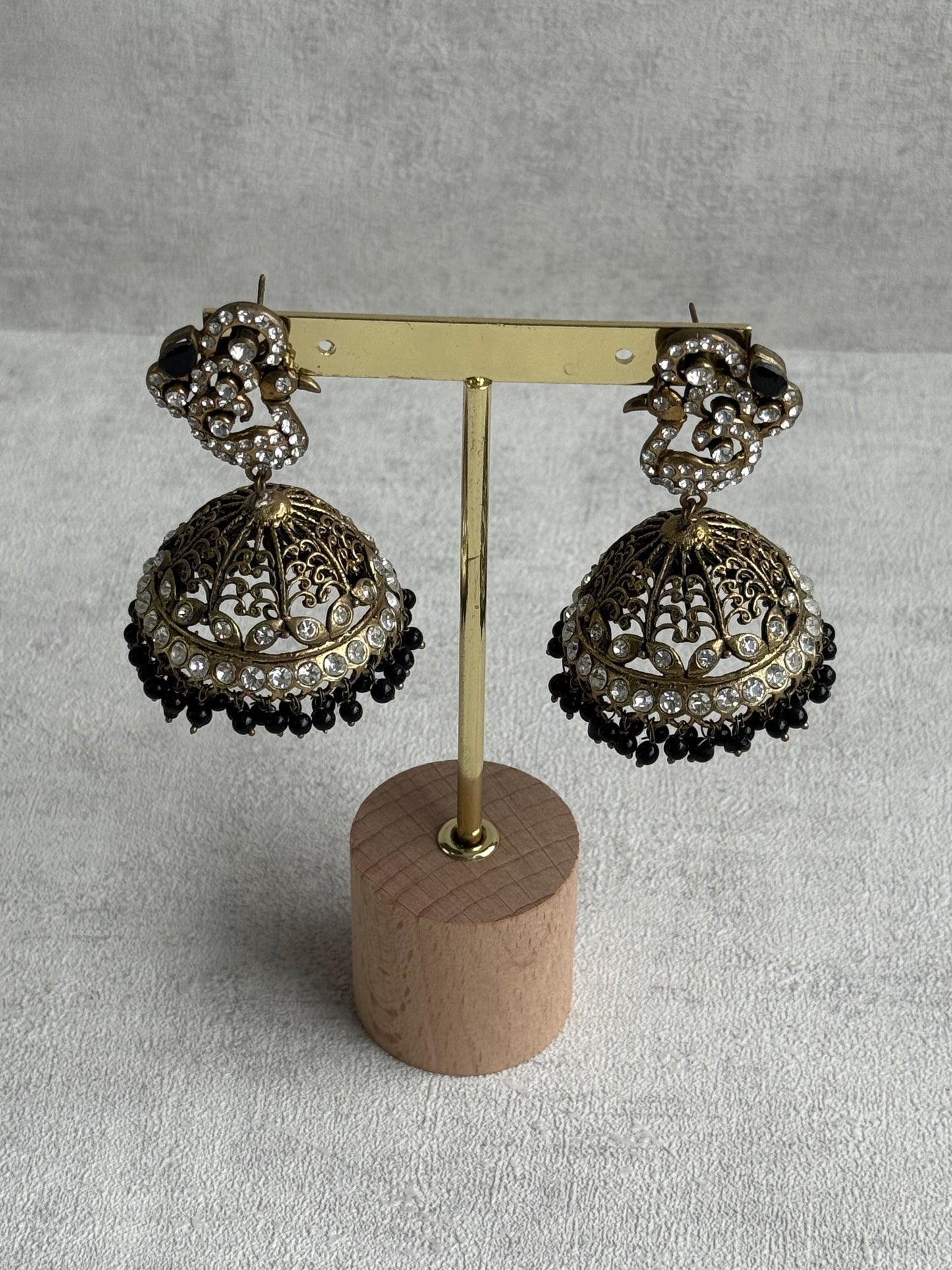 Ayura Designs Mayurika Jhumkis – Antique Gold Jhumkis with Crystal Stones, Black Beads & Peacock Motif