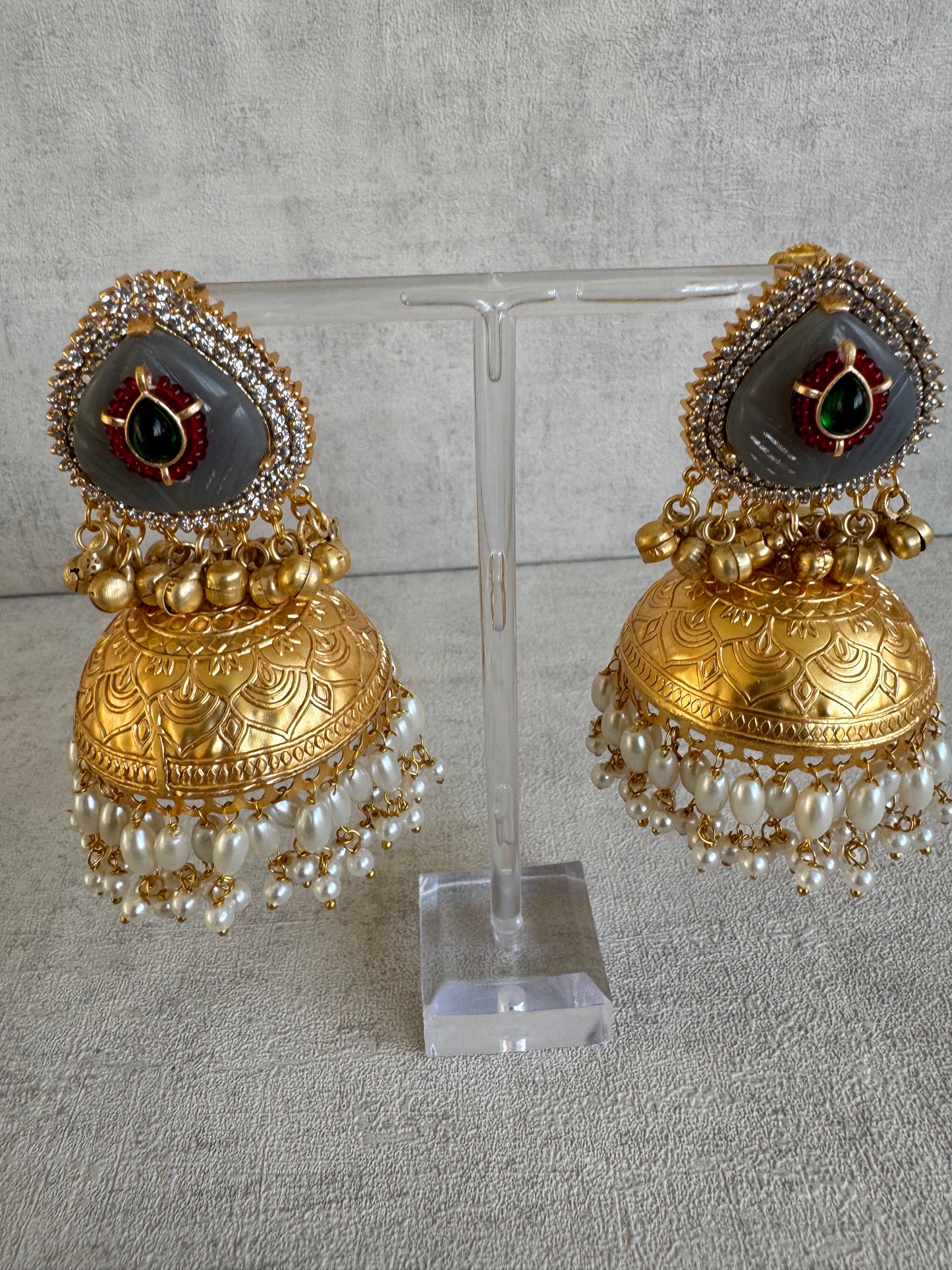 Ayura Designs Ziva Jhumkis – Handcrafted in Antique-Finish Brass with Grey Enamel Studs, Green Stone Detail & Pearl Clusters