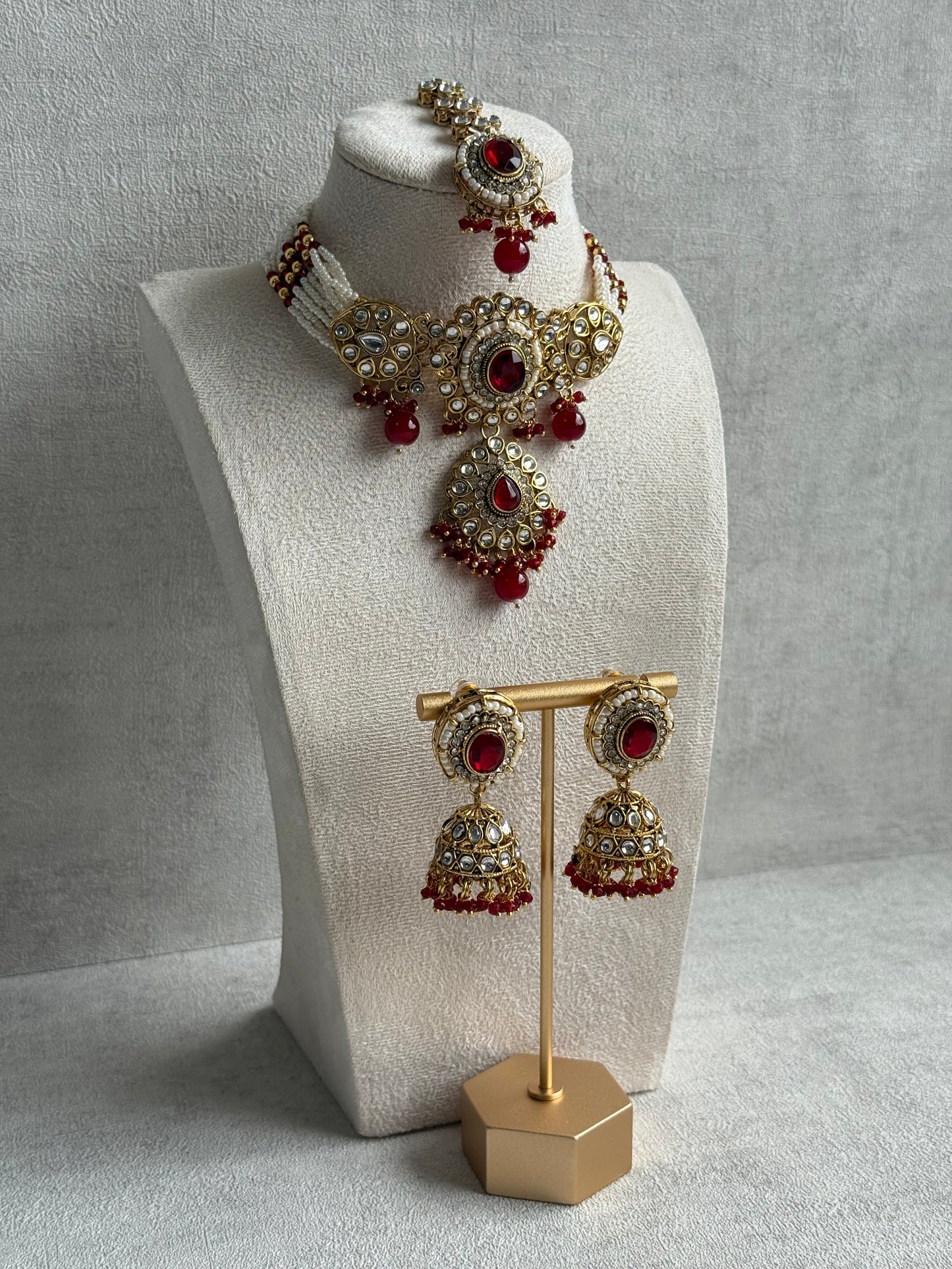 Ayura Designs Muskaan Set – Choker, Jhumkis & Tikka with Ruby Red Beads, Kundan Stones & Antique Gold Finish