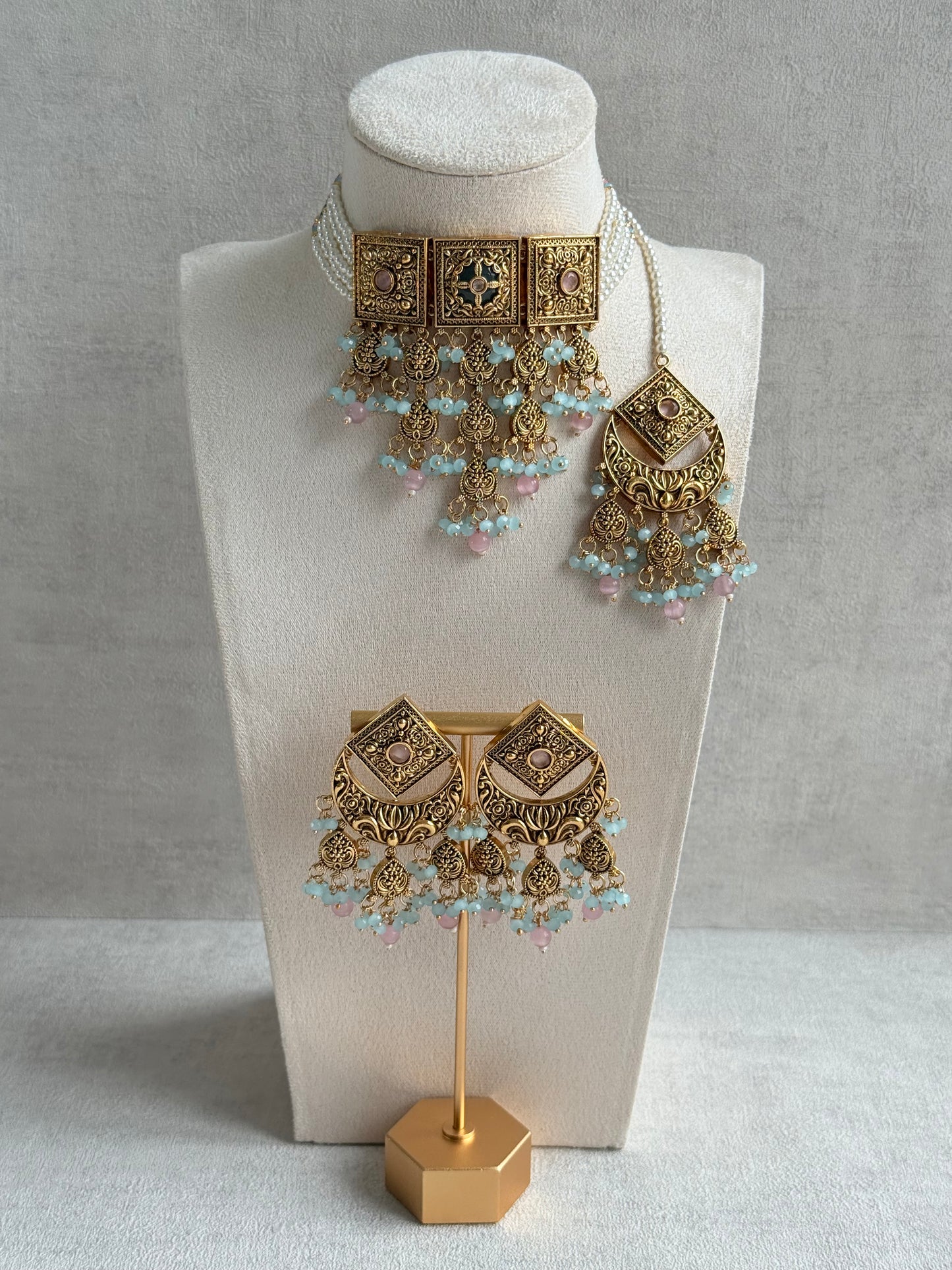 Ayura Designs Samera Choker Set with Earrings & Tikka – Aqua Blue & Blush Pink Beads, Green Centre Stone, Floral Motifs & Antique Gold Finish