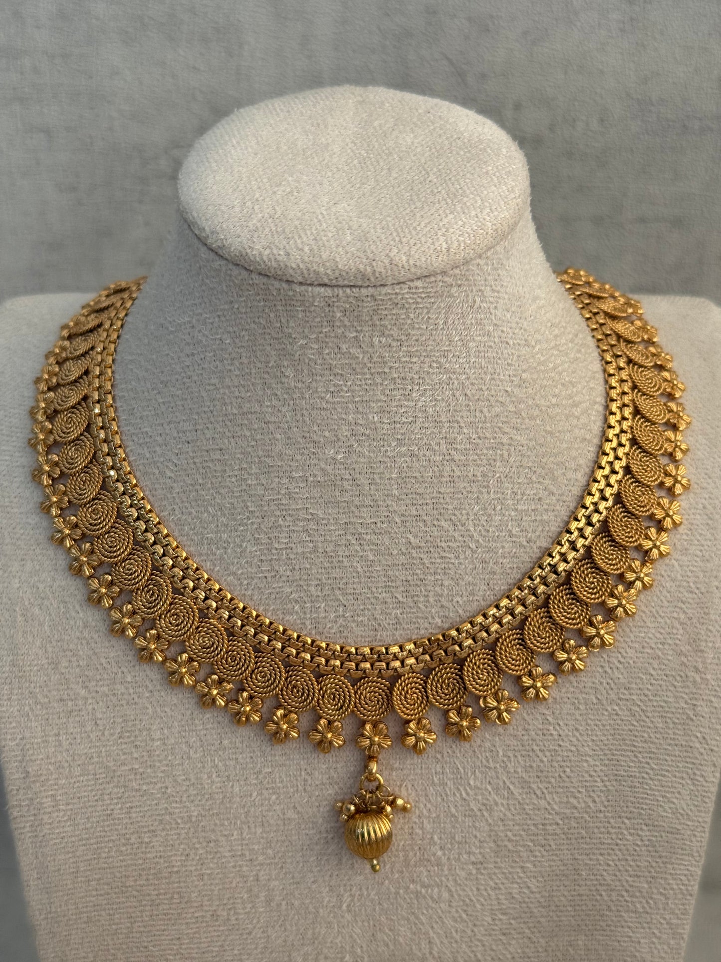 Ayura Designs Purna Set with Necklace & Earrings – Antique Gold Finish, Floral Motifs & Textured Pendant Detail