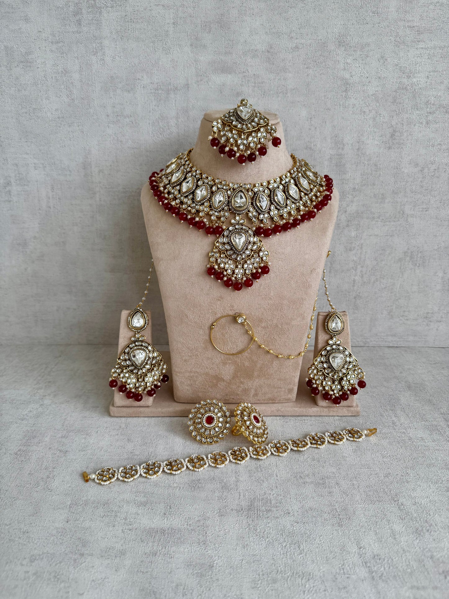 Ayura Designs Gulbahar Bridal Set with Necklace, Jhumkis, Tikka, Nath, Ring & Sheeshphool – Jadau Kundan Craftsmanship with Mirror-Cut Polki, Red Beads & Antique Gold Finish