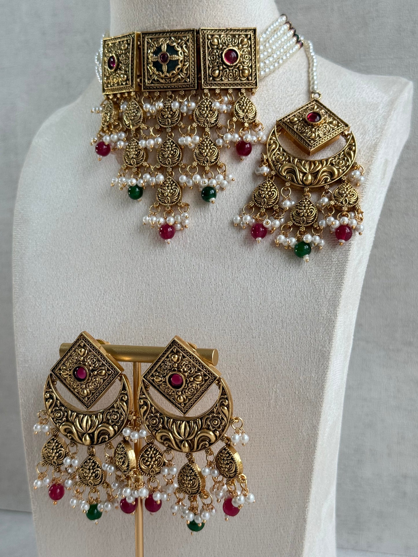 Ayura Designs Samera Choker Set with Earrings & Tikka – Rani Pink & Emerald Green Beads, Pearl Detailing, Green Centre Stone, Floral Motifs & Antique Gold Finish