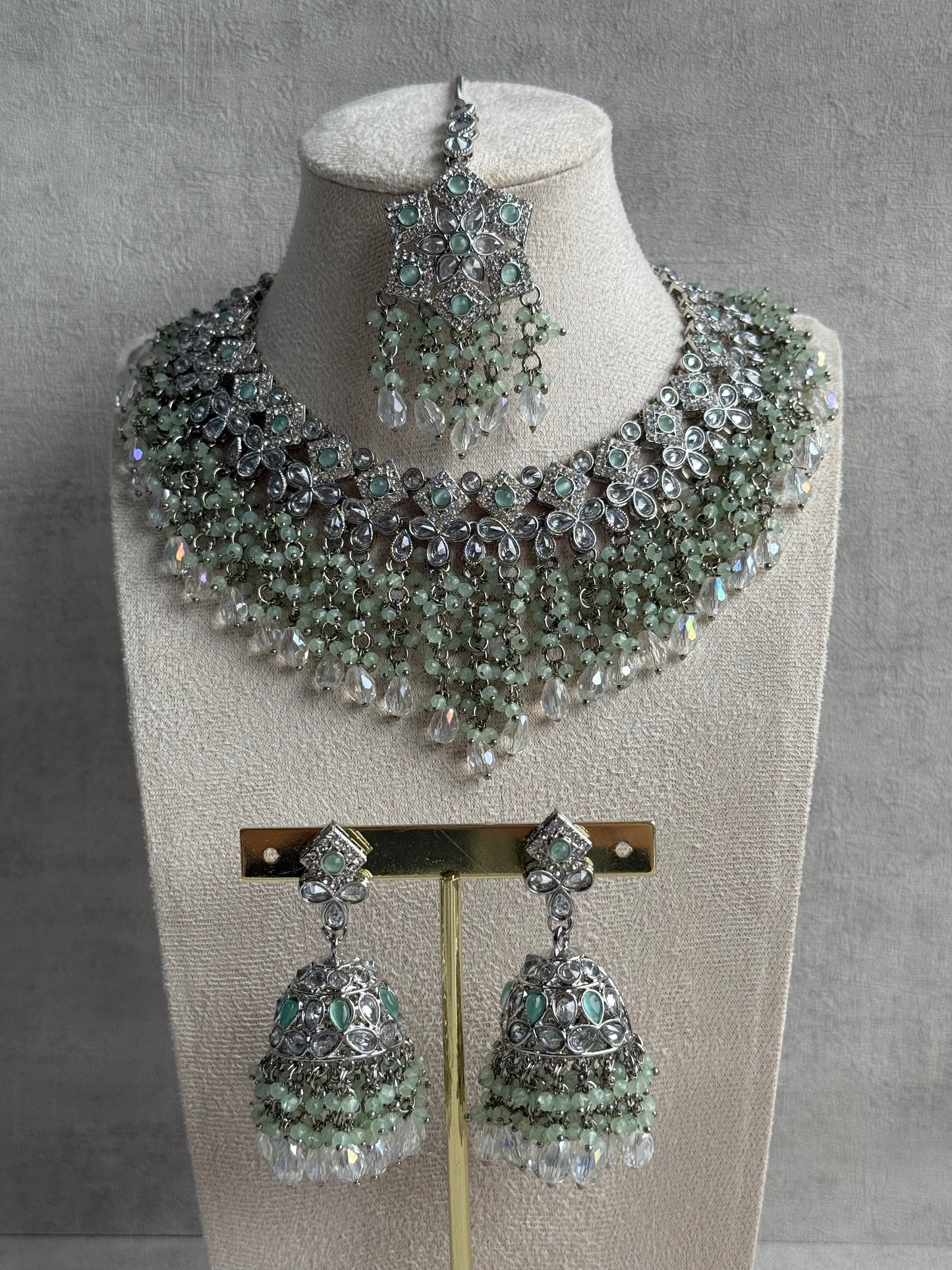Ayura Designs Rayna Set – Necklace, Jhumkis & Tikka with Mint Green Beads, Mirror-Cut Stones & Silver Finish
