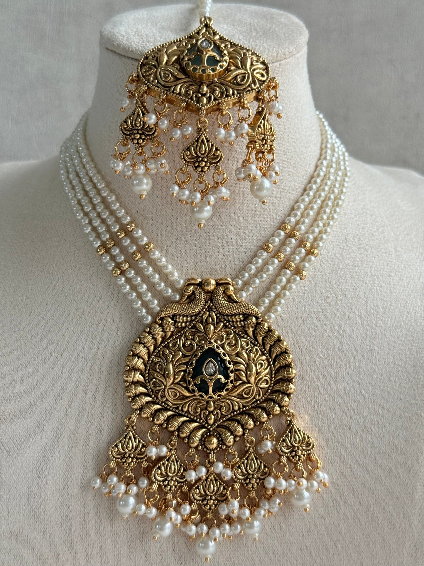 Ayura Designs Afia Necklace Set with Earrings & Tikka – Antique Gold, Ivory Pearls, Green Centre Stone & Peacock Motifs