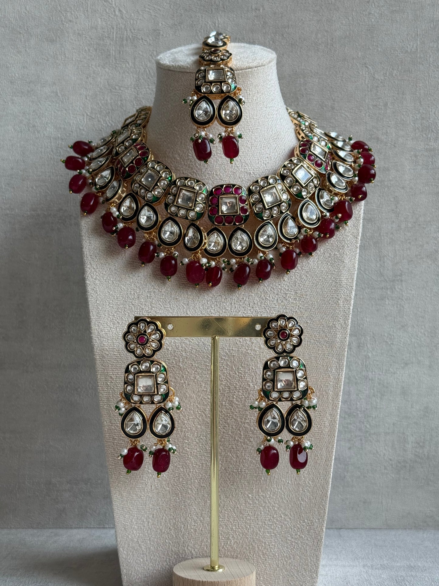 Ayura Designs Salma Set – Necklace, Earrings & Tikka with Mirror-Cut Kundan, Ruby Red Beads, Emerald Green Meenakari & Gold Finish