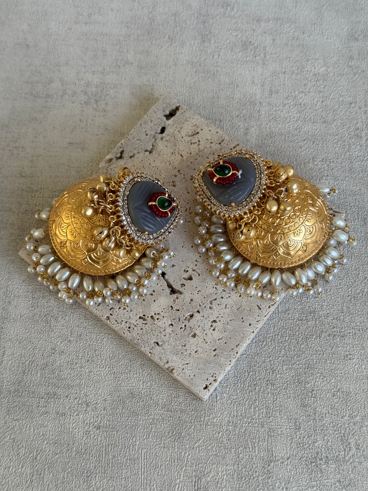 Ayura Designs Ziva Jhumkis – Handcrafted in Antique-Finish Brass with Grey Enamel Studs, Green Stone Detail & Pearl Clusters