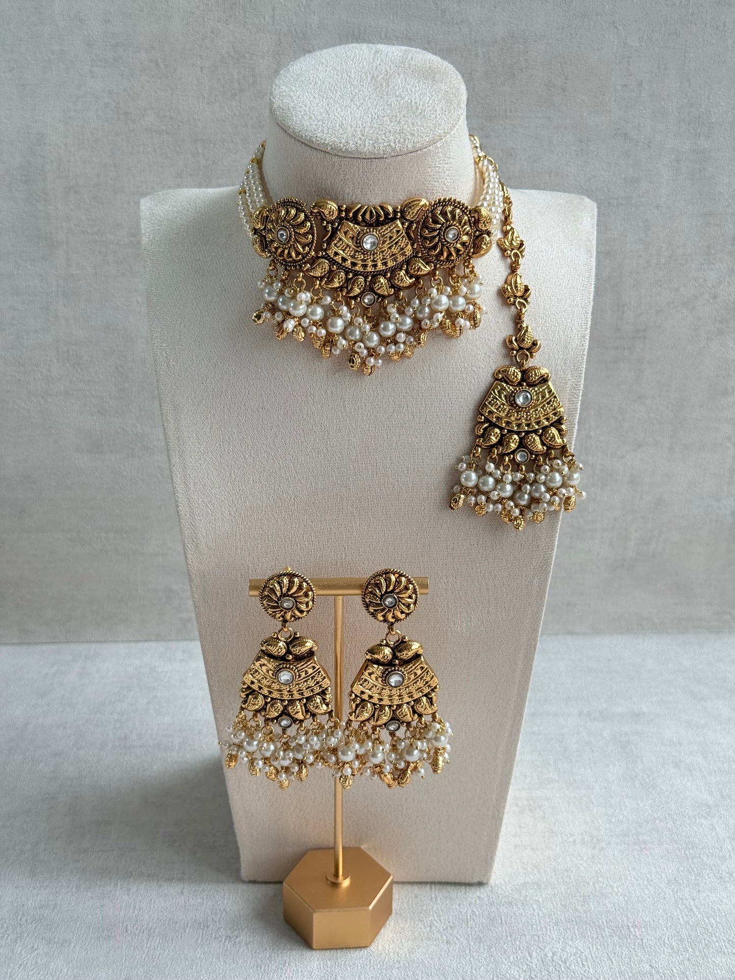 Ayura Designs Sairish Choker Set with Earrings & Tikka – Ivory Beads, Pearl Detailing, Ghungroos, Paisley Motifs & Antique Gold Finish