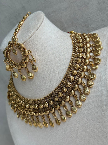 Ayura Designs Falaq Necklace Set with Earrings & Tikka – Gold Finish with Layered Chain, Floral & Shell Drop Detailing