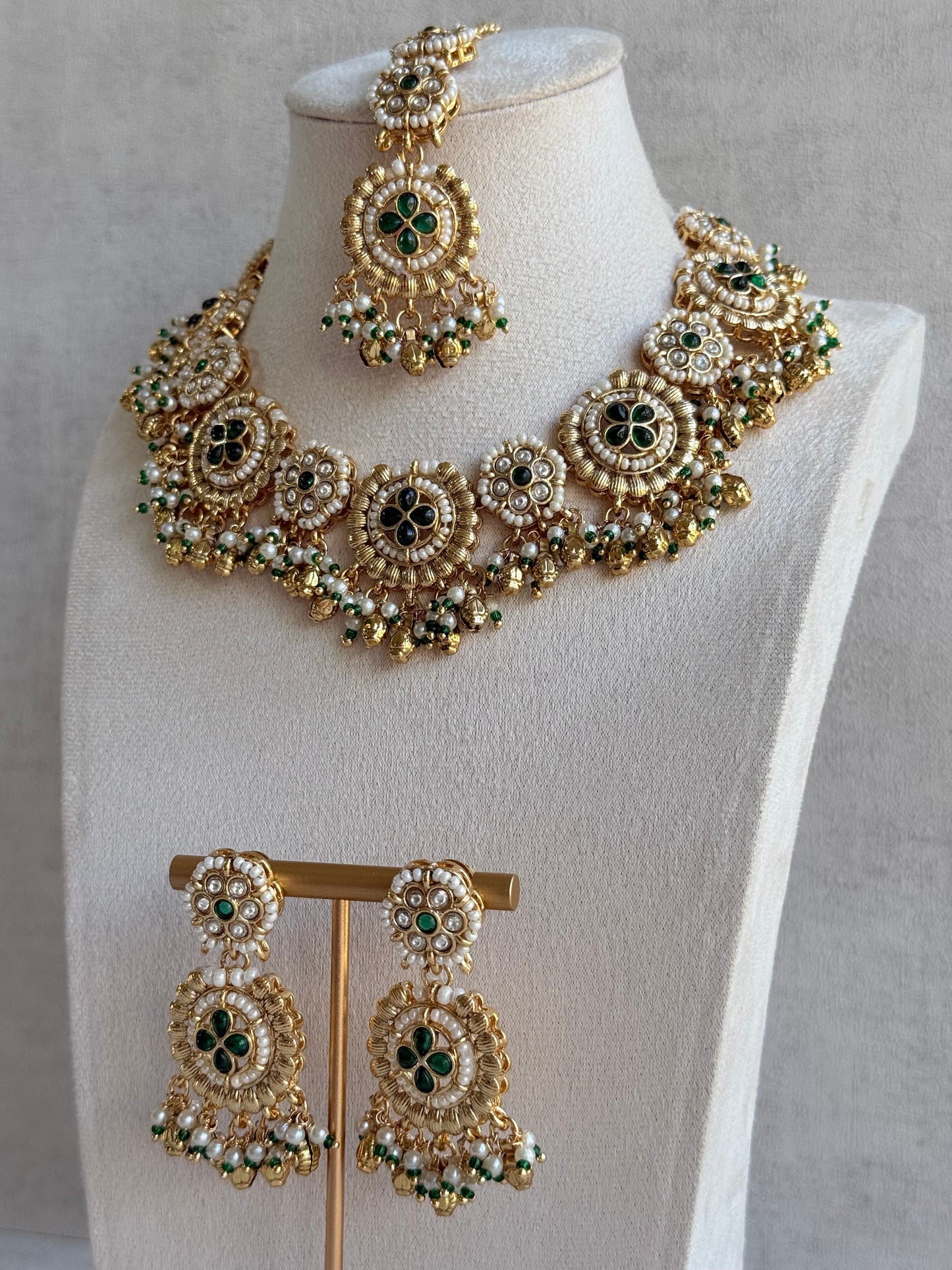 Ayura Designs Manika Necklace Set with Earrings & Tikka – Gold Finish with Emerald Green Stones, Pearls & Ghungroos