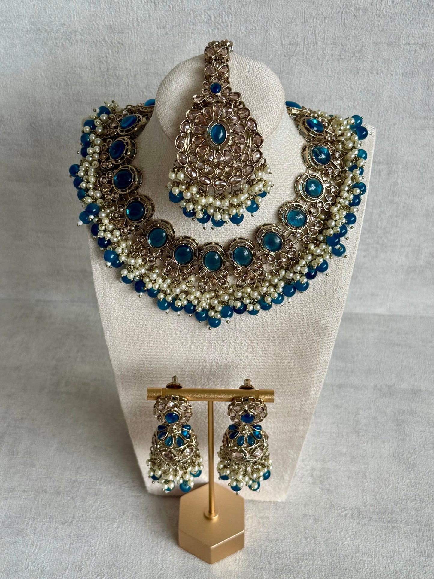 Ayura Designs Zubi Set with Jhumkis & Tikka – Deep Blue Stones, Pearl Detailing & Antique Gold Finish
