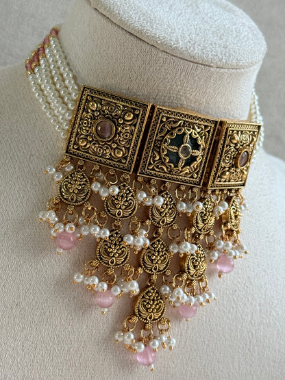 Ayura Designs Samera Choker Set with Earrings & Tikka – Blush Pink Beads, Pearl Detailing, Green Centre Stone, Floral Motifs & Antique Gold Finish