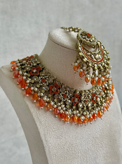 Ayura Designs Jazba Set with Necklace, Jhumkis & Tikka – Antique Gold, Mirror-Cut Stones, Pearl Detailing & Fiery Orange Beads