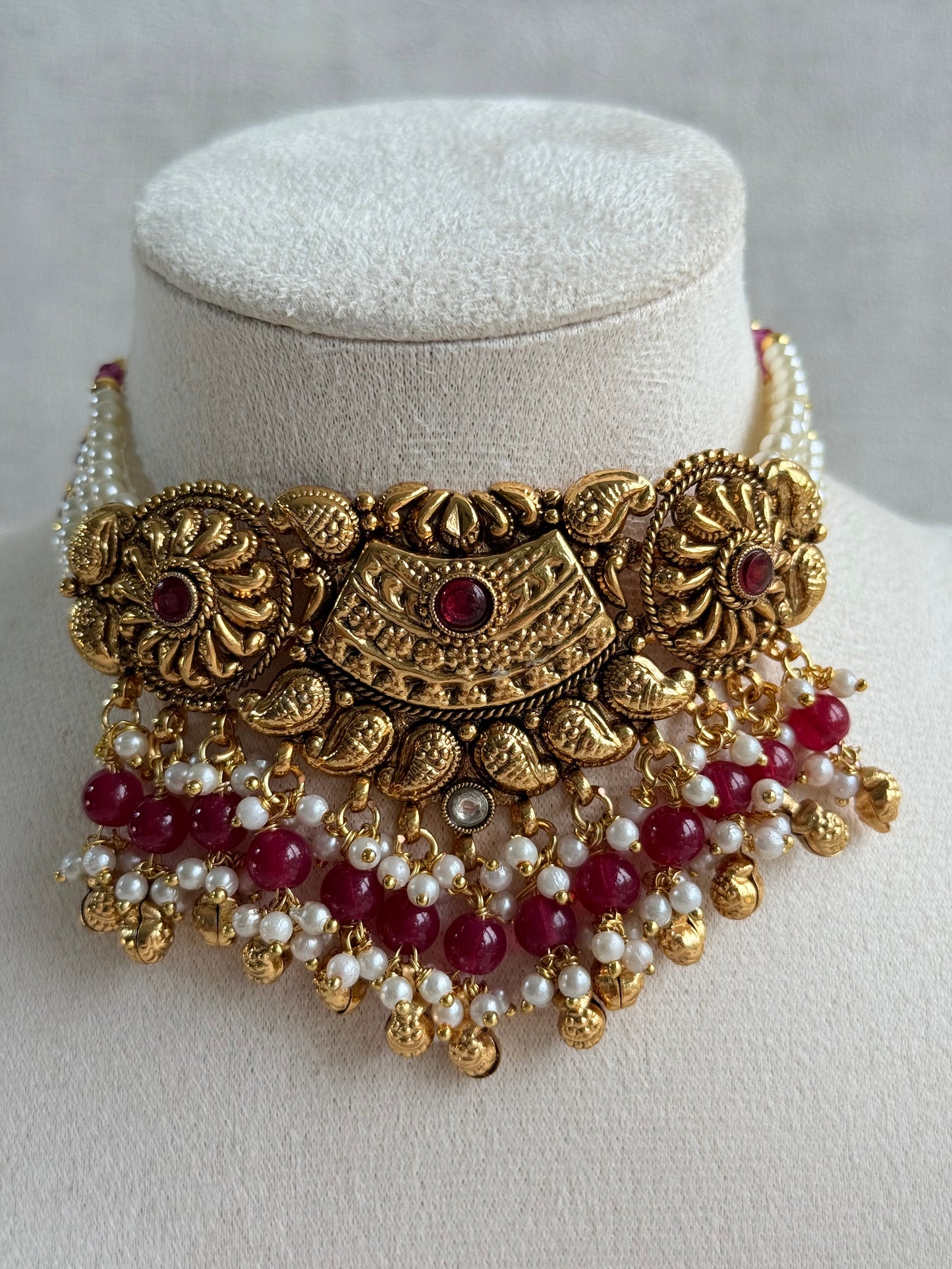 Ayura Designs Sairish Choker Set with Earrings & Tikka – Ruby Pink Beads, Pearl Detailing, Ghungroos, Paisley Motifs & Antique Gold Finish