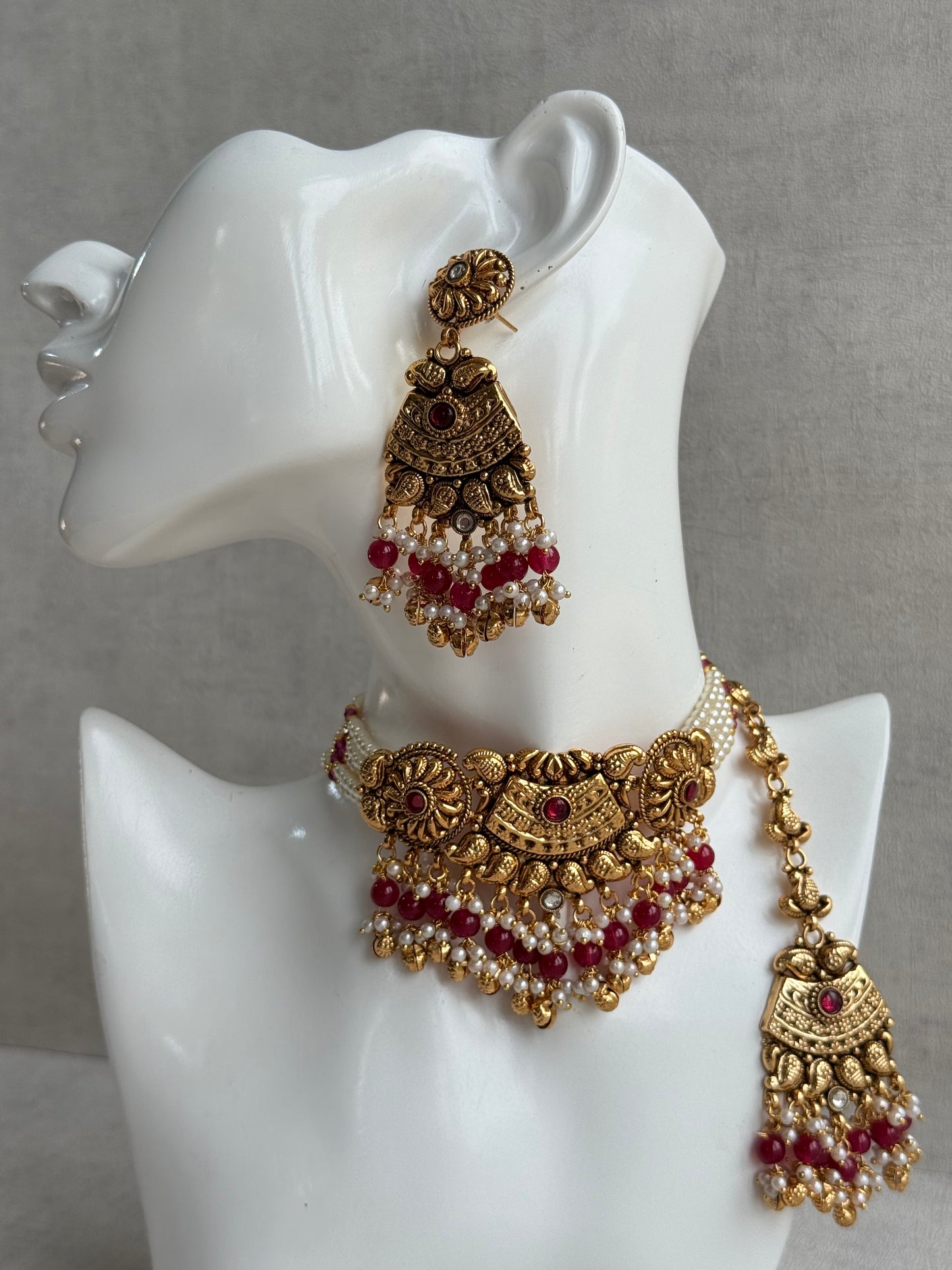 Ayura Designs Sairish Choker Set with Earrings & Tikka – Ruby Pink Beads, Pearl Detailing, Ghungroos, Paisley Motifs & Antique Gold Finish