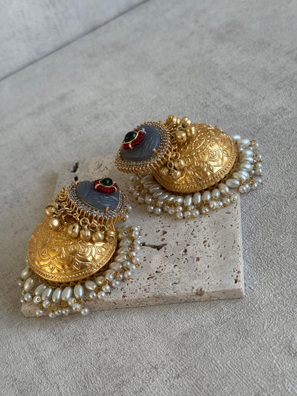 Ayura Designs Ziva Jhumkis – Handcrafted in Antique-Finish Brass with Grey Enamel Studs, Green Stone Detail & Pearl Clusters