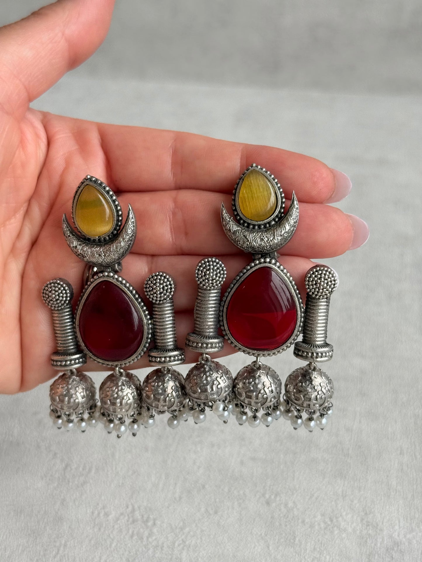 Ayura Designs Qissa Earrings – Oxidised Triple Jhumki Earrings with Ruby Red Stones & Pearl Detailing