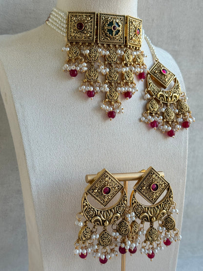 Ayura Designs Samera Choker Set with Earrings & Tikka – Rani Pink Beads, Pearl Detailing, Green Centre Stone, Floral Motifs & Antique Gold Finish