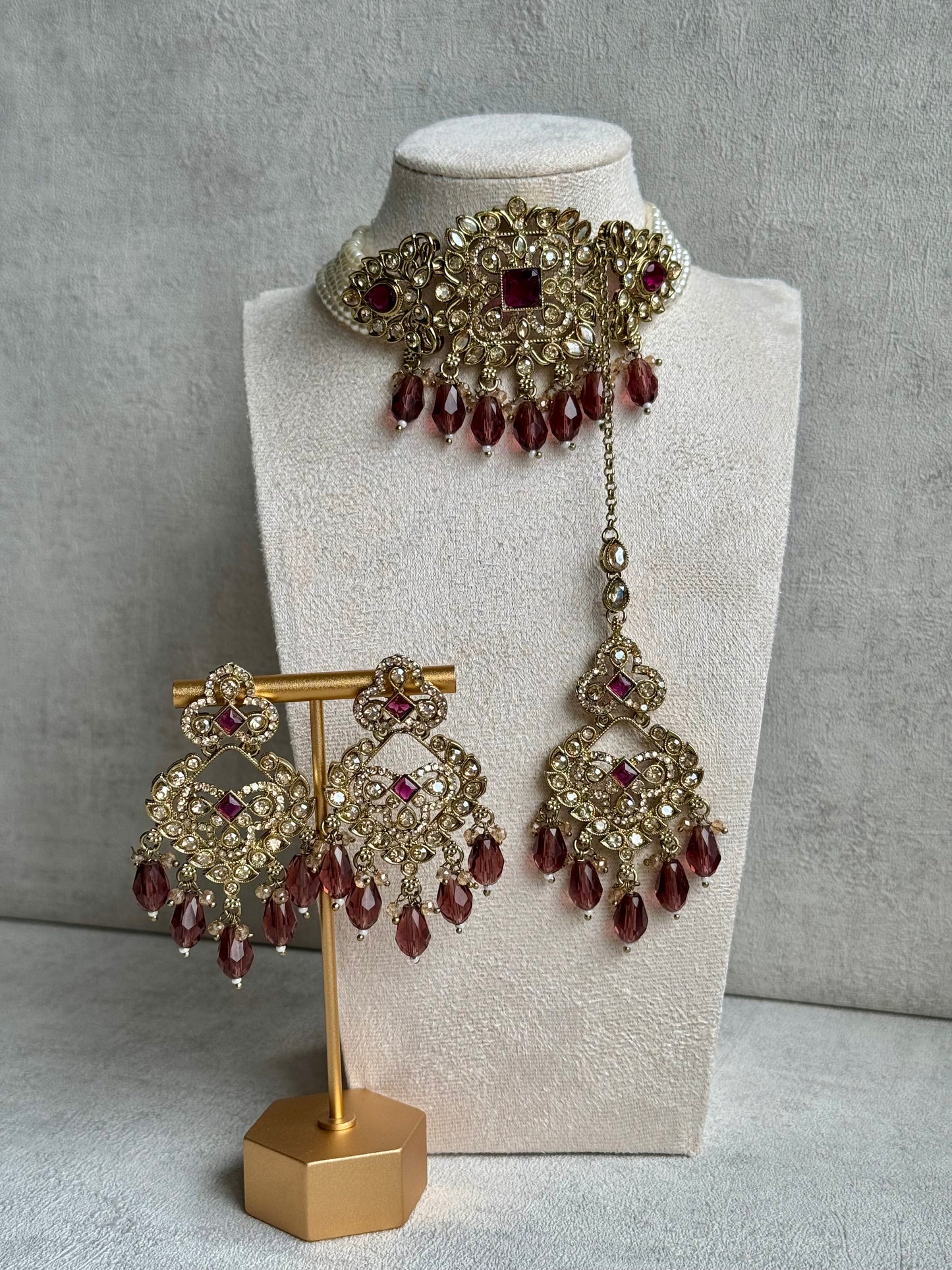 Ayura Designs Alveena Set – Majestic Gold-Tone Choker, Opulent Chandelier Earrings & Tikka, Lavishly Adorned with Radiant Wine-Tinted Crystals