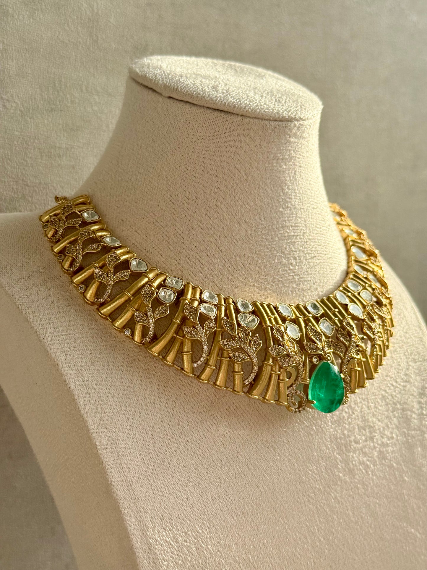 Ayura Designs Rami Collar Set with Jhumkis – Sculpted Gold Collar with Emerald Green Stone and Crystal Detailing