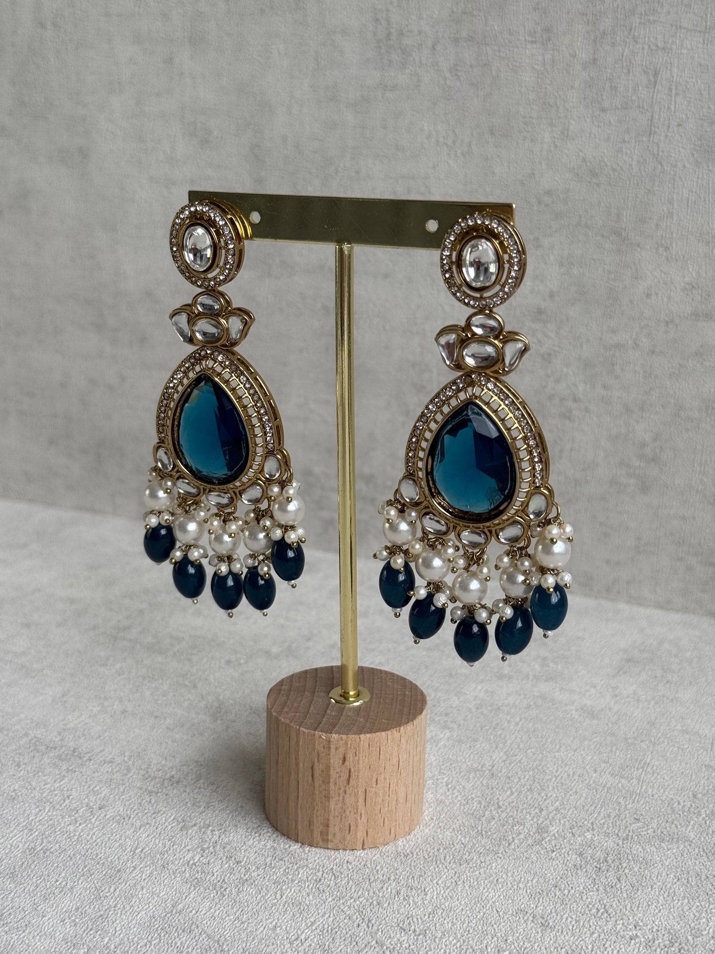 Ayura Designs Nageen Earrings – Antique Gold Jhumkis with Ink Blue Stones, Mirror-Cut Detailing & Pearl Drops