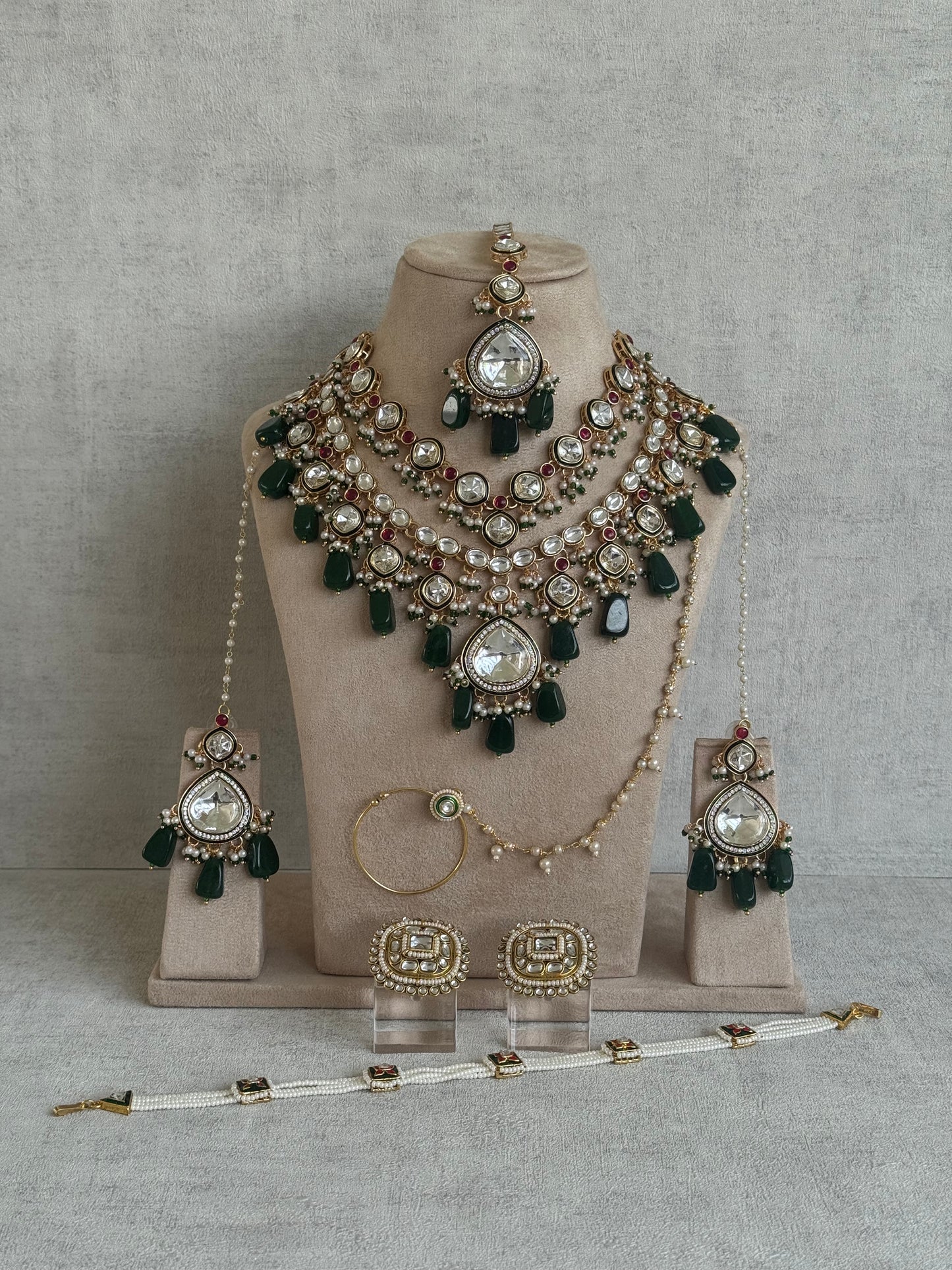 Ayura Designs Malika Bridal Set with Necklace, Jhumkis, Tikka, Nath, Ring & Sheeshphool – Jadau Kundan Craftsmanship with Mirror-Cut Polki, Emerald Green Drops, Ruby Accents & Antique Gold Finish