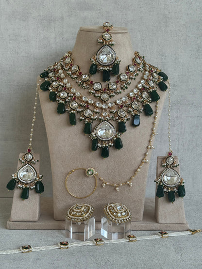 Ayura Designs Malika Bridal Set with Necklace, Jhumkis, Tikka, Nath, Ring & Sheeshphool – Jadau Kundan Craftsmanship with Mirror-Cut Polki, Emerald Green Drops, Ruby Accents & Antique Gold Finish