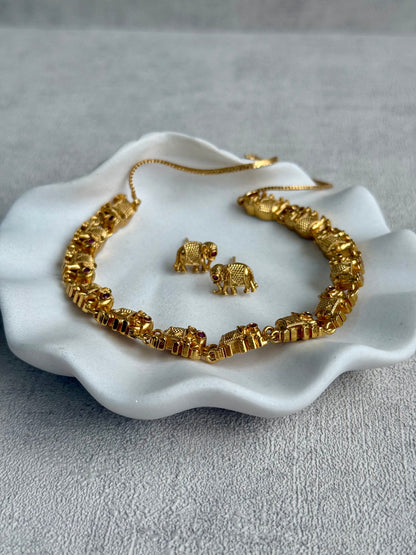 Ayura Designs Veda Set – Antique Gold Necklace & Stud Earrings with Elephant Motifs and Pink Stone Detailing