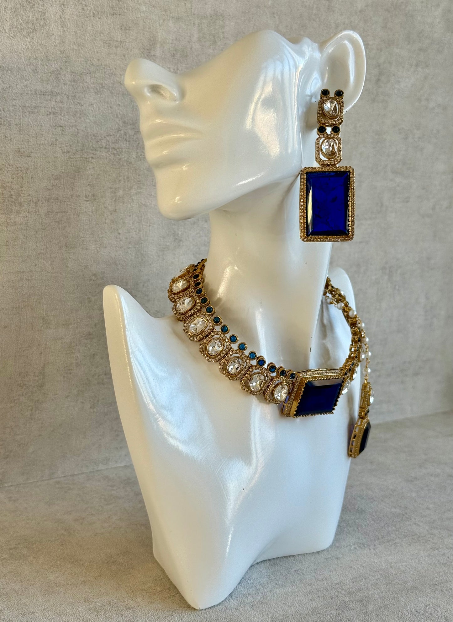 Ayura Designs Clara Set with Earrings & Tikka  – Royal Blue Stones with Moissanite and Antique Gold Finish