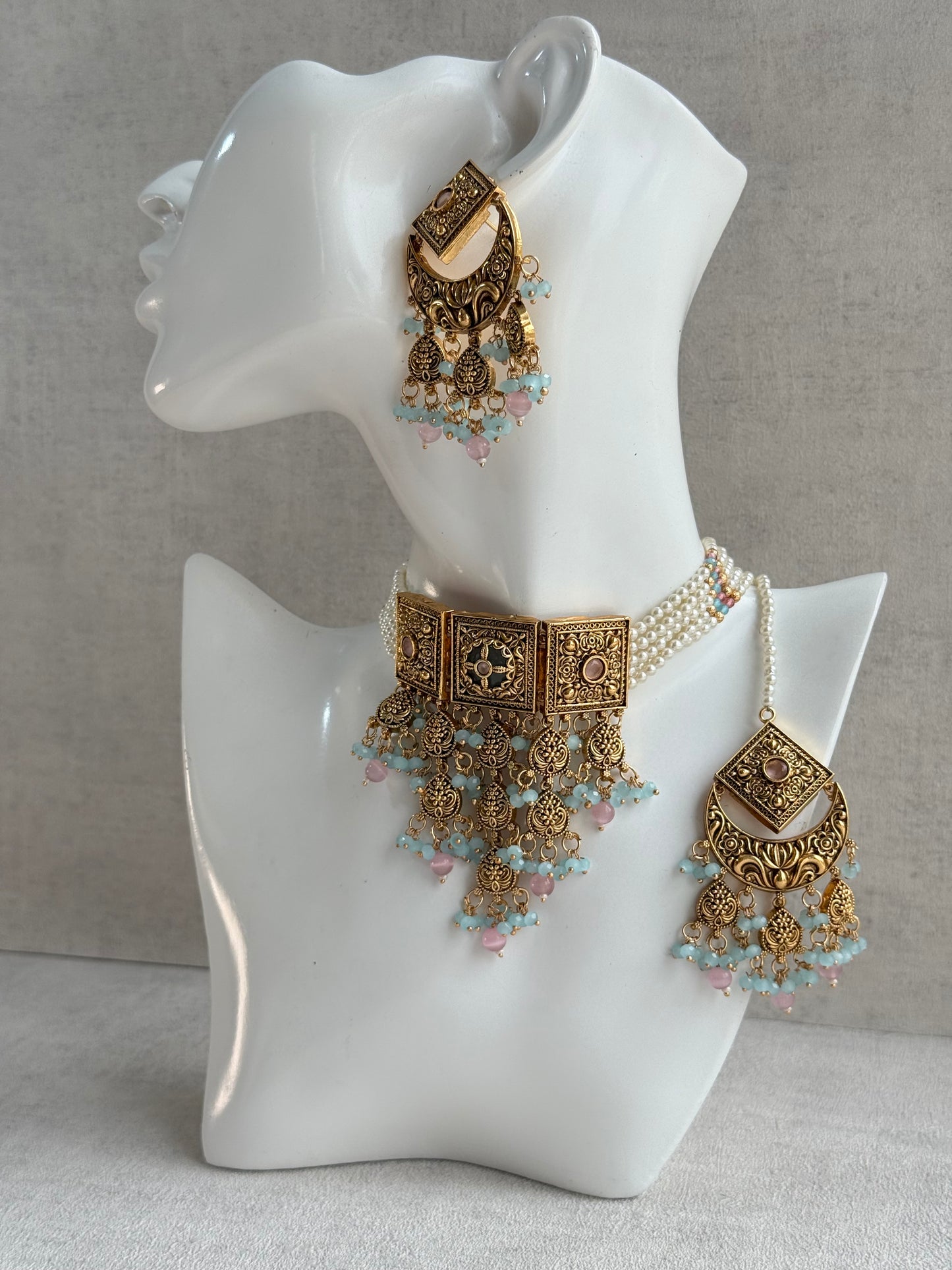 Ayura Designs Samera Choker Set with Earrings & Tikka – Aqua Blue & Blush Pink Beads, Green Centre Stone, Floral Motifs & Antique Gold Finish