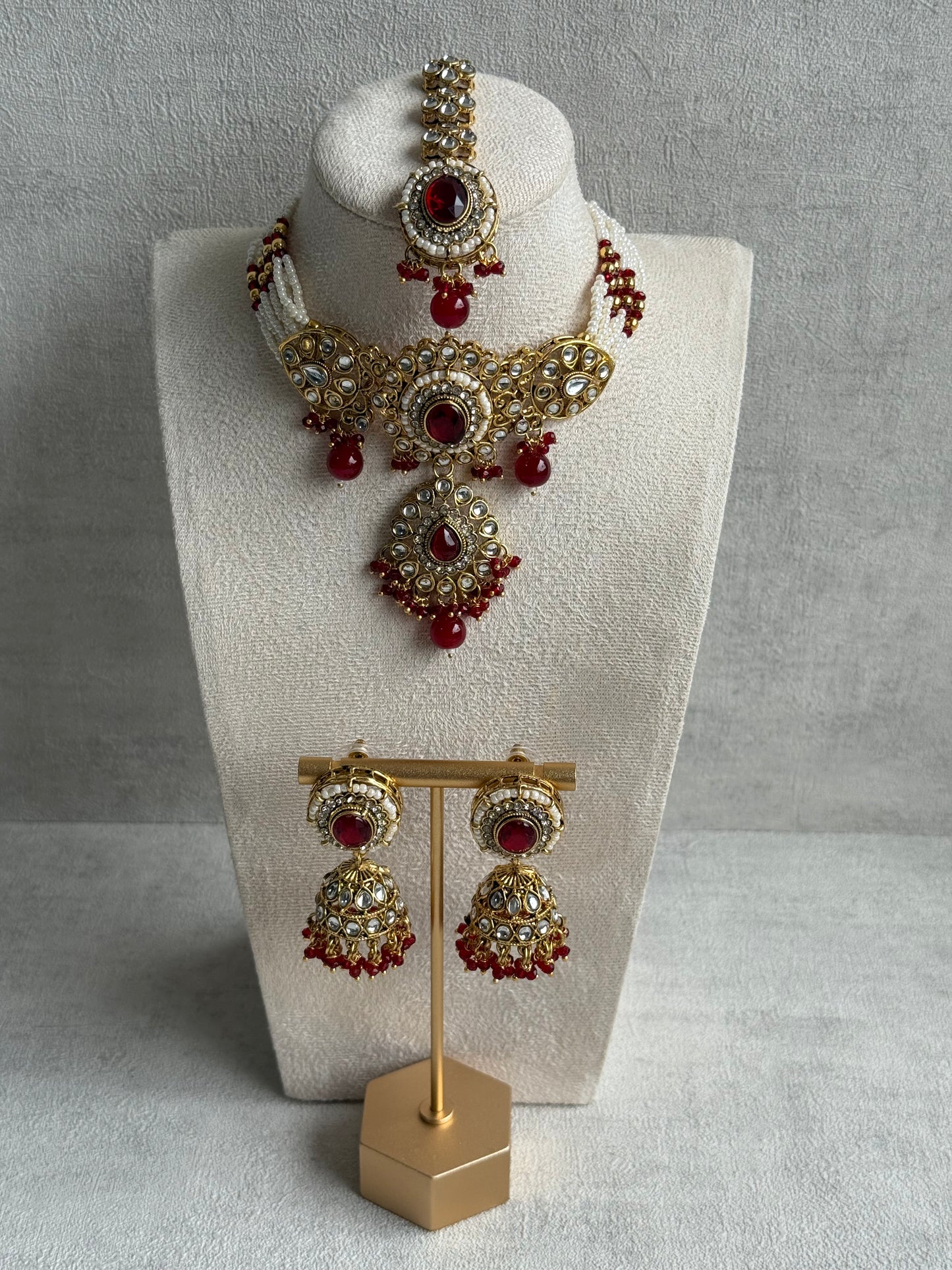 Ayura Designs Muskaan Set – Choker, Jhumkis & Tikka with Ruby Red Beads, Kundan Stones & Antique Gold Finish
