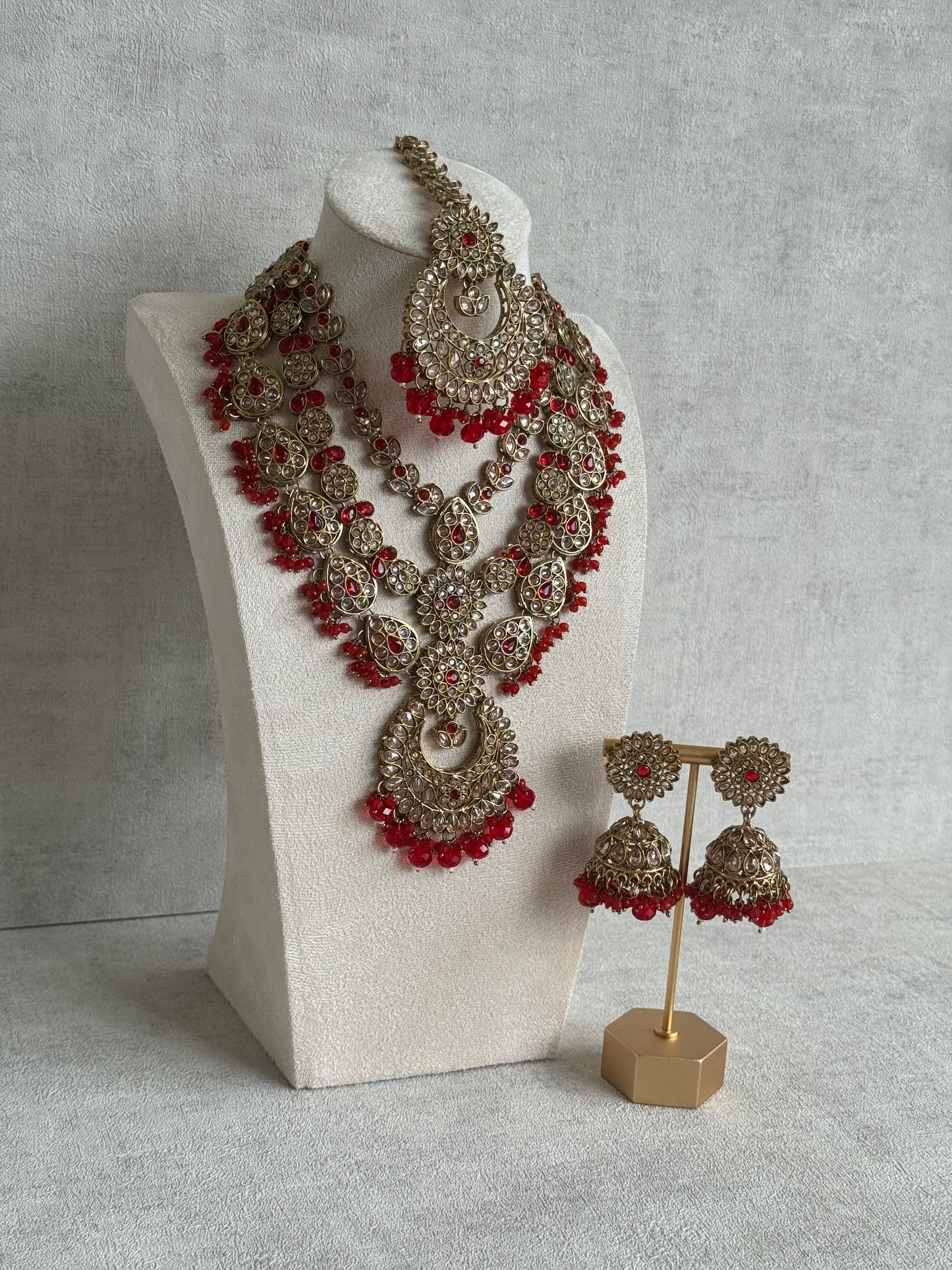 Ayura Designs Samreen Set with Tikka & Jhumkis – in Antique Gold with Red Beads & Mirror-Cut Stones