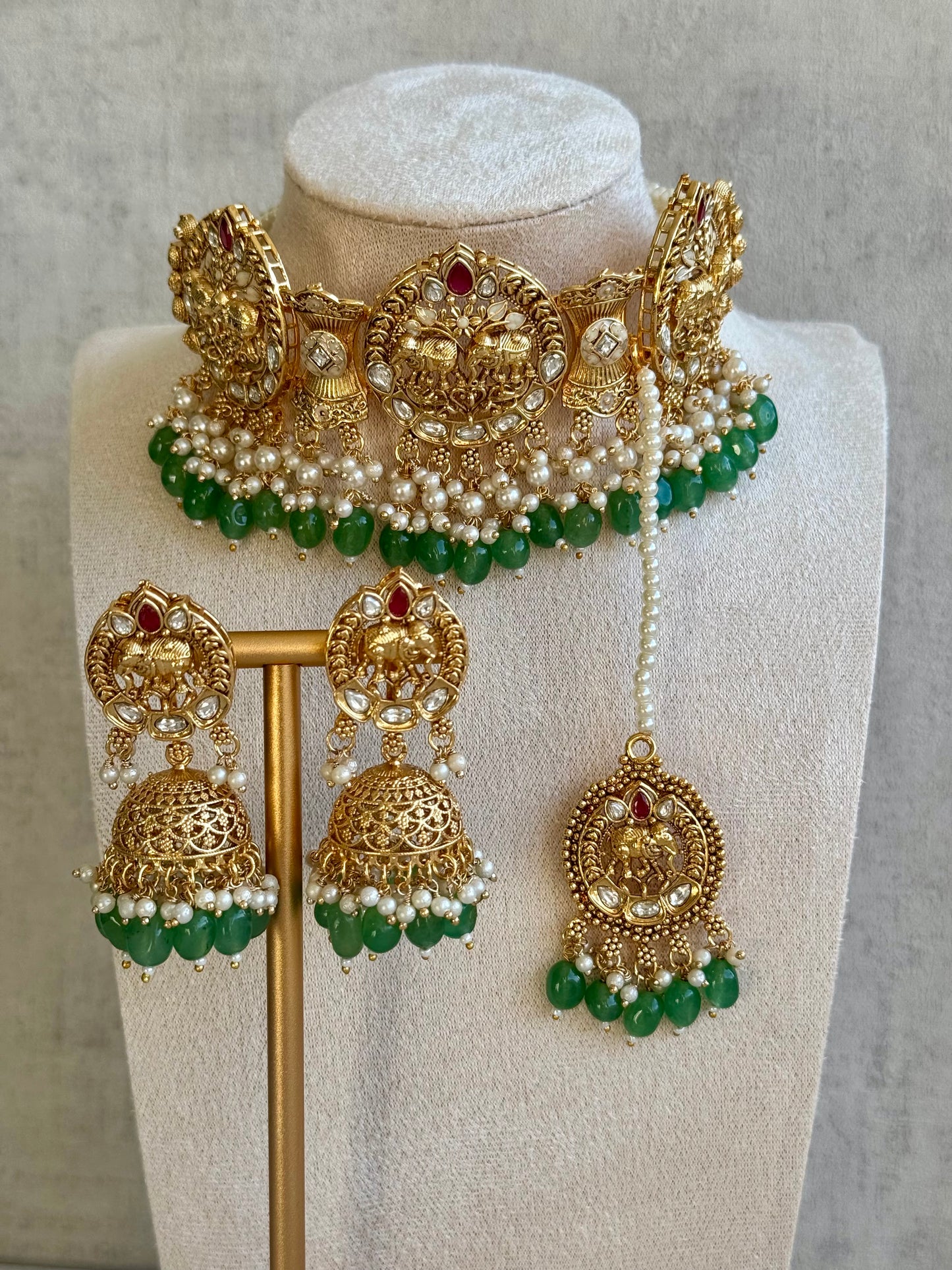 Ayura Designs Tanu Choker Set with Earrings & Tikka – A Golden Harmony of Pearls, Emerald Hues & Crimson Accents