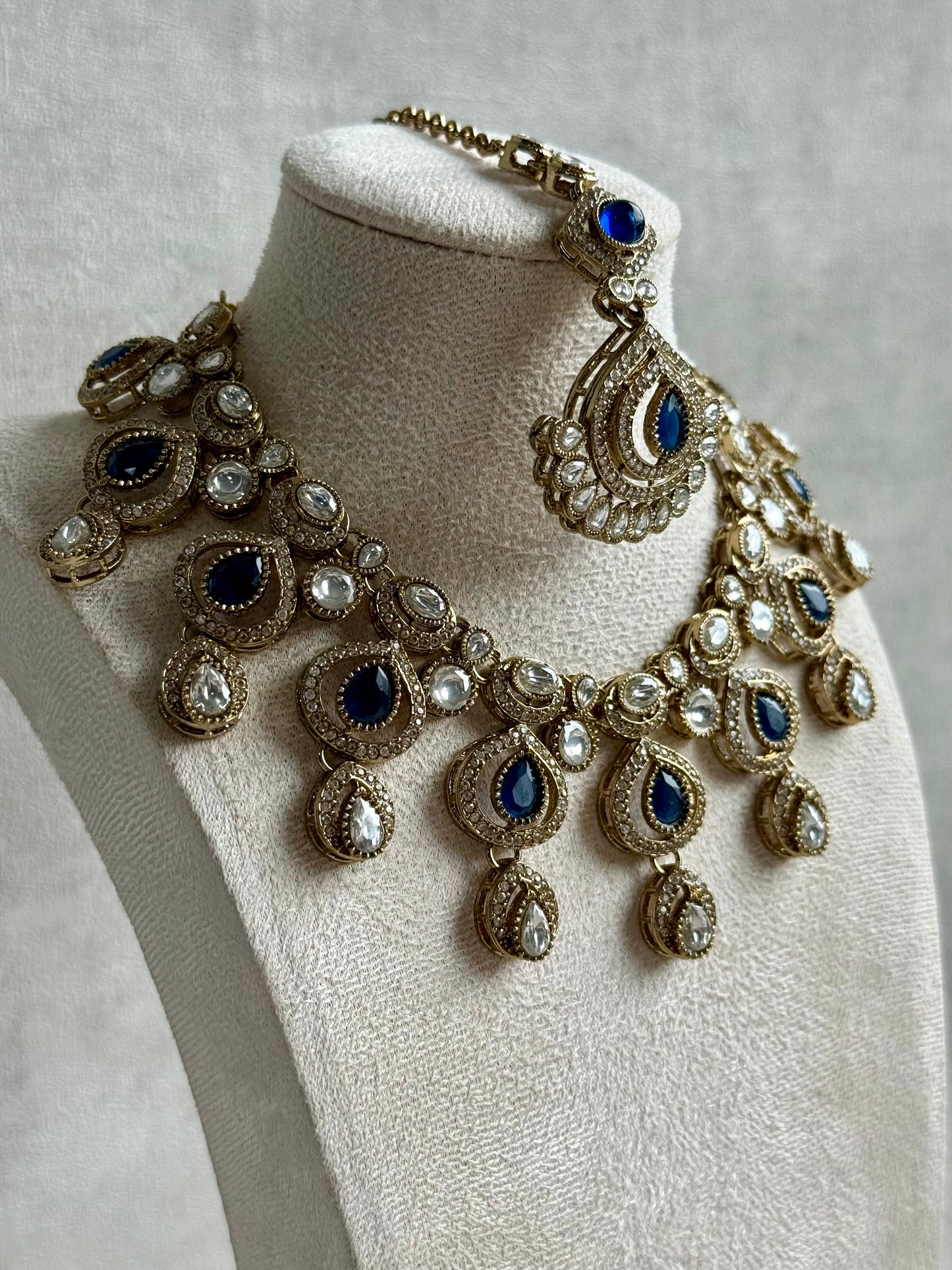 Ayura Designs Sahira Set – Necklace, Earrings & Tikka with Sapphire Blue Stones, Mirror-Cut Detailing & Antique Gold Finish