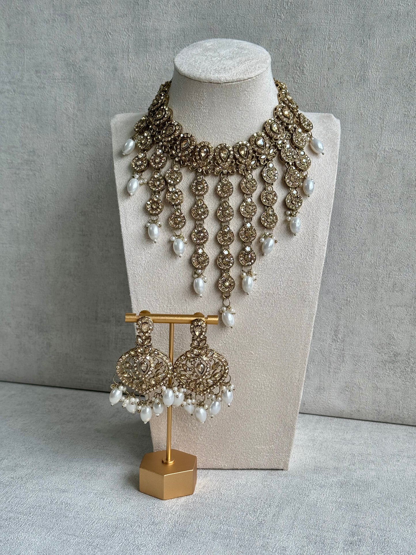 Ayura Designs Sameena Set – Opulent Champagne Gold Adorned with Luminous White Pearls Featuring a Statement Necklace, Tikka, and Chandelier Earrings