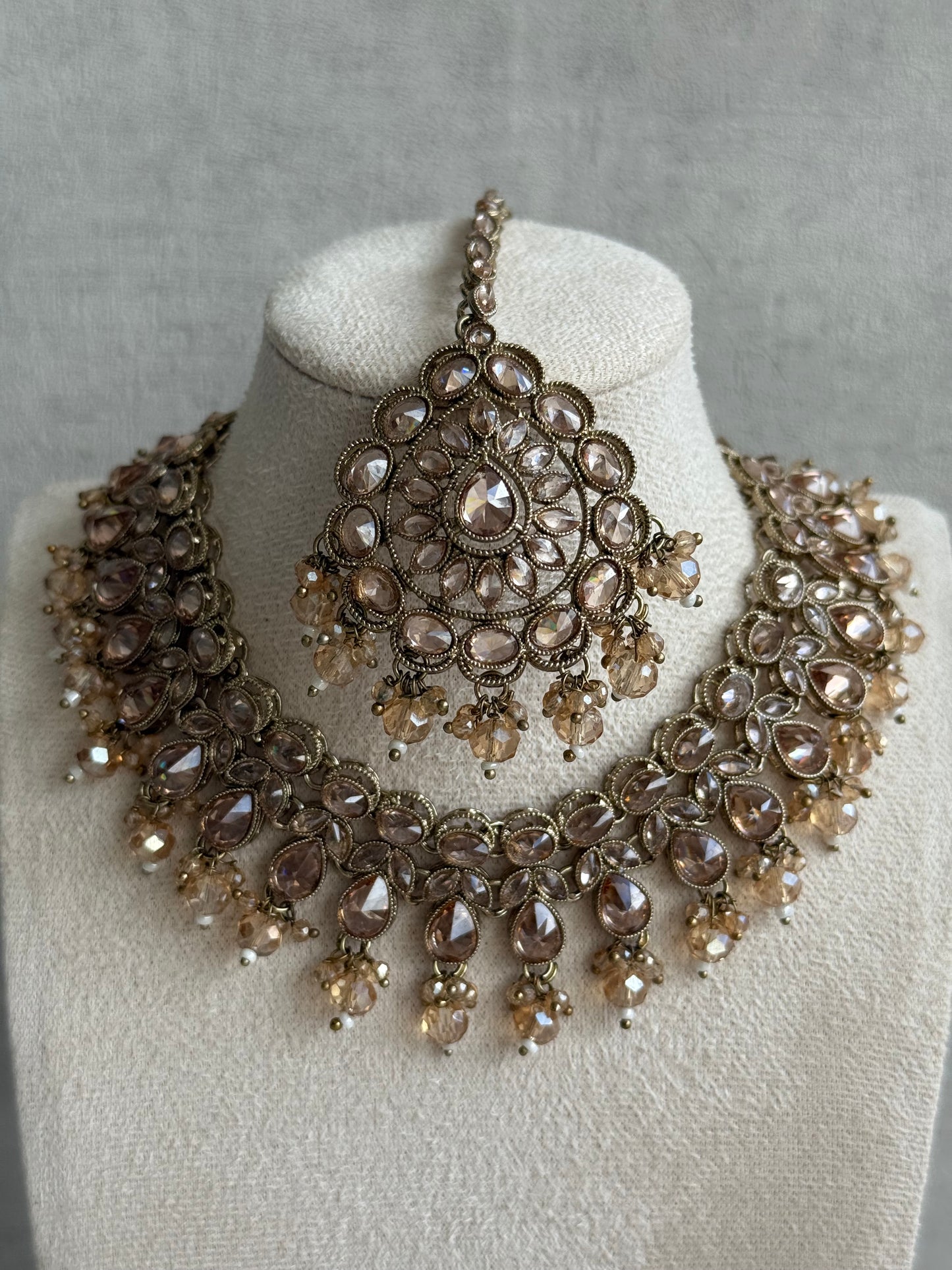 Ayura Designs Emaan Set with Jhumkis & Tikka – Champagne Stones, Antique Gold Finish & Crystal Detailing