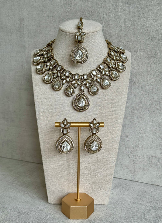 Ayura Designs Soha Set with Necklace, Earrings & Tikka – Mirror-Cut Clear Stones in Antique Gold Finish