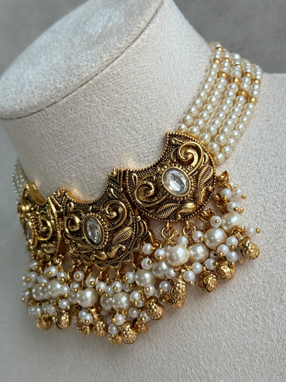 Ayura Designs Sneha Choker Set with Earrings & Tikka – Ivory Beads, Layered Pearl Detailing, Ghungroos & Antique Gold Finish