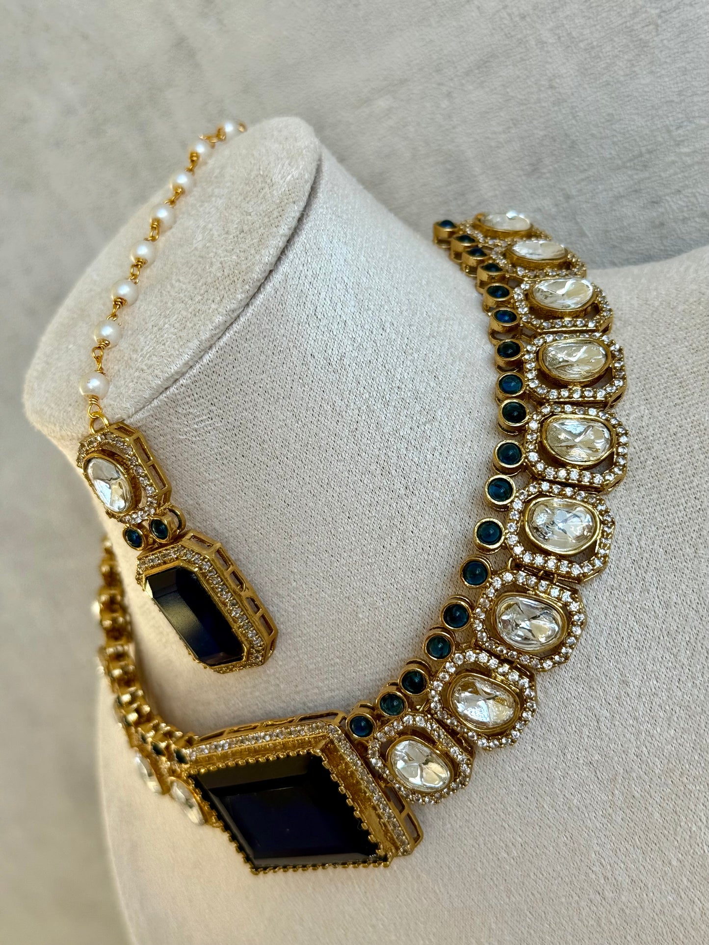 Ayura Designs Clara Set with Earrings & Tikka  – Royal Blue Stones with Moissanite and Antique Gold Finish