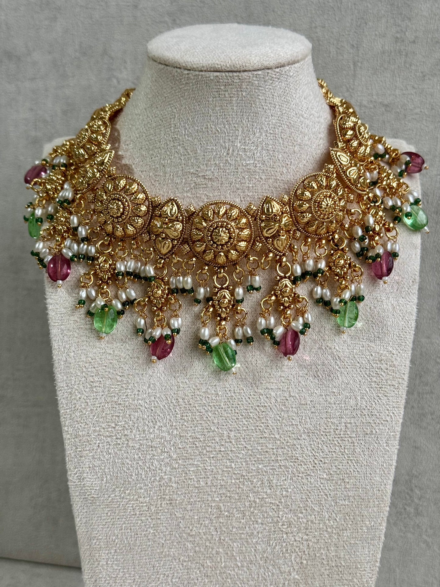 Ayura Designs Rummy Set – Opulent Gold Adornment with Radiant Pink, Green & White Beads | Includes Earrings & Tikka