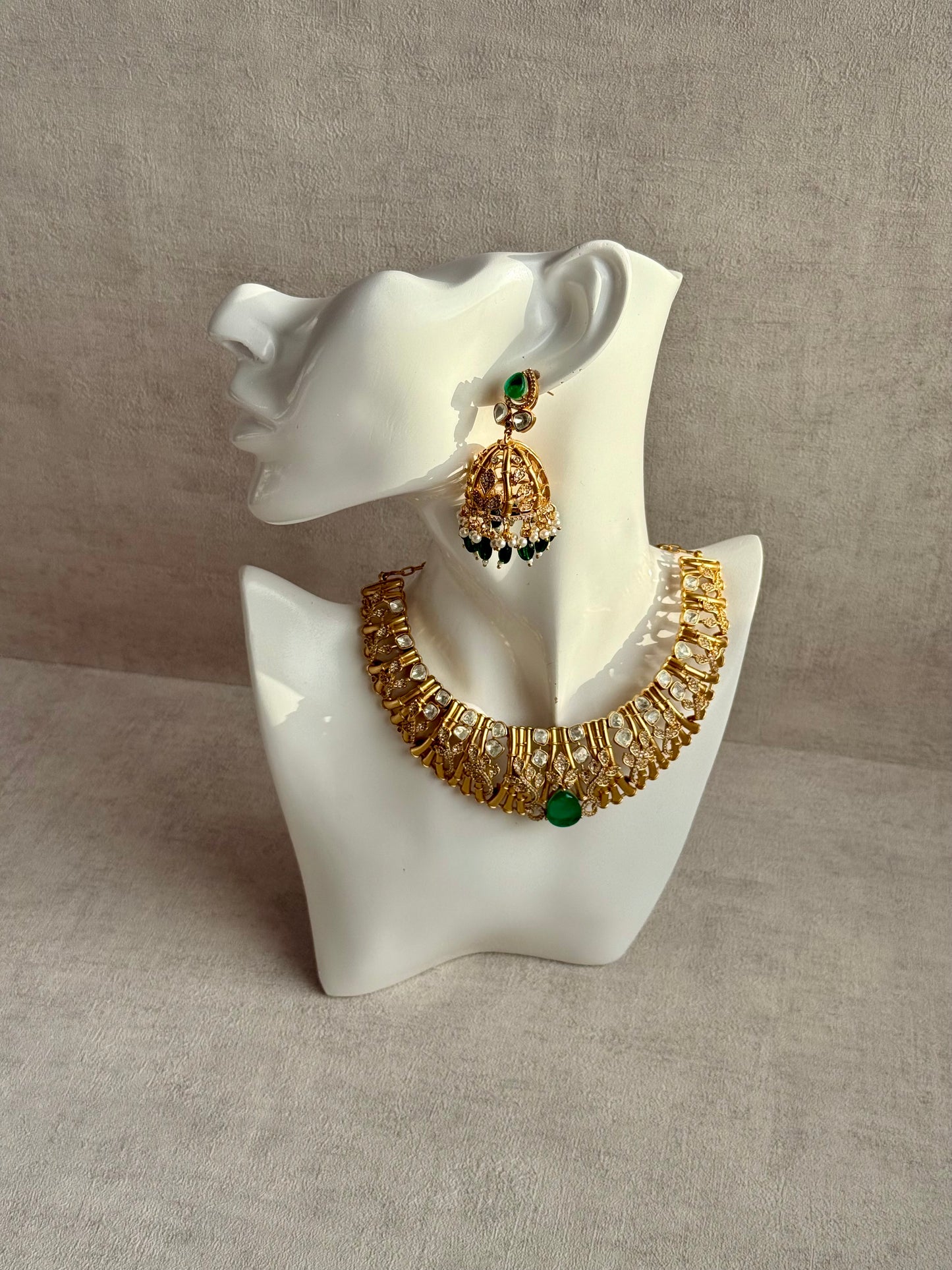 Ayura Designs Rami Collar Set with Jhumkis – Sculpted Gold Collar with Emerald Green Stone and Crystal Detailing