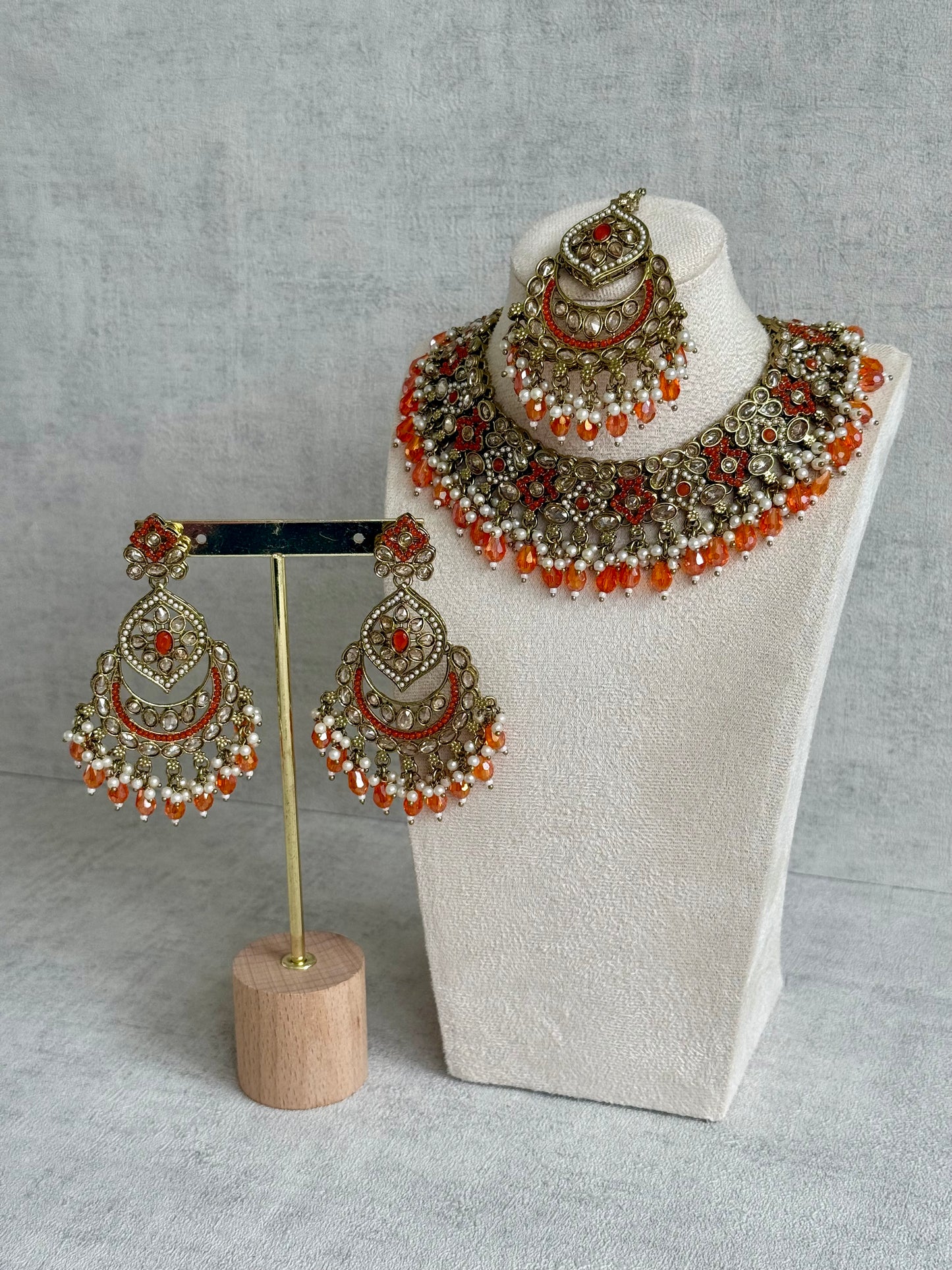 Ayura Designs Jazba Set with Necklace, Jhumkis & Tikka – Antique Gold, Mirror-Cut Stones, Pearl Detailing & Fiery Orange Beads