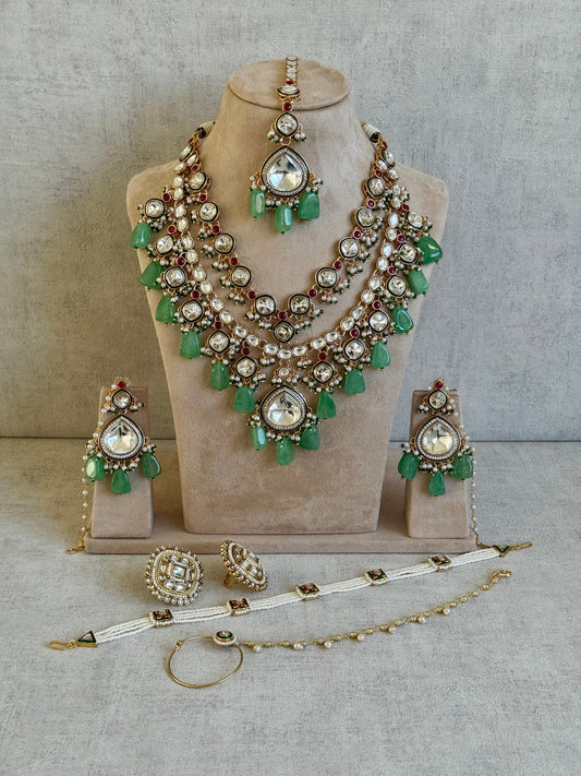 Ayura Designs Malika Bridal Set with Necklace, Jhumkis, Tikka, Nath, Ring & Sheeshphool – Jadau Kundan Craftsmanship with Mirror-Cut Polki, Jade-Toned Drops, Ruby Accents & Antique Gold Finish