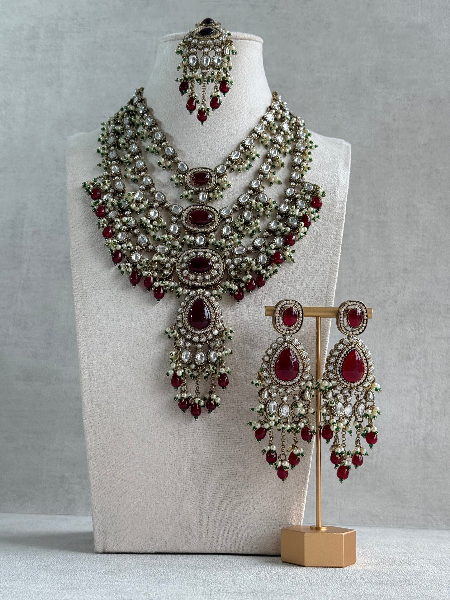 Ayura Designs Sahra Bridal Set with Earrings & Tikka – Ruby Red, Kundan Stones, Pearls & Emerald Green Accents in Antique Gold Finish