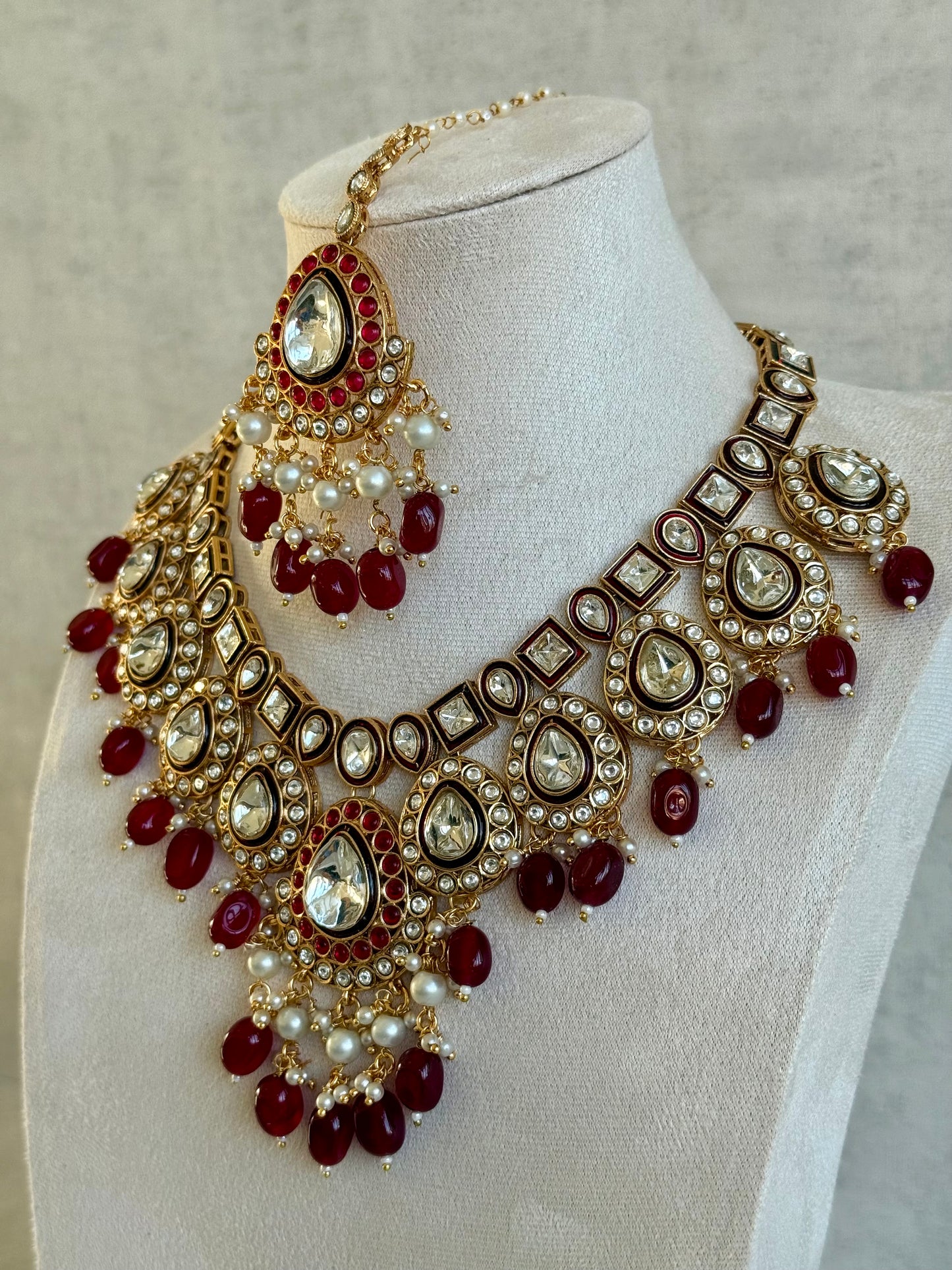 Ayura Designs Ishyat Set with Necklace, Earrings & Tikka – Kundan Detailing, Ruby Red Drops & Ivory Pearls