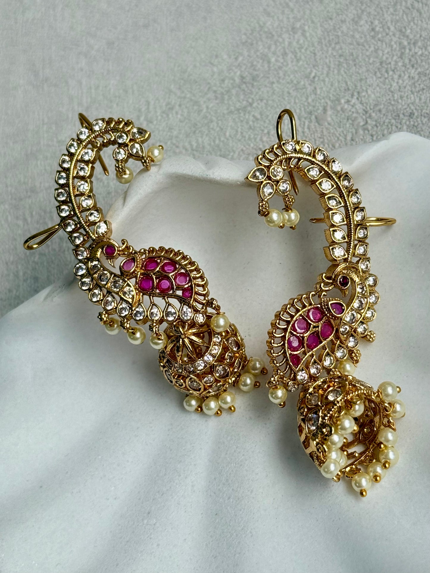 Ayura Designs Padma Earrings – Gold Half Ear Cuffs with Peacock Motif, Pink Stone Accents, Kundan Crystals & Pearl Jhumka Drops