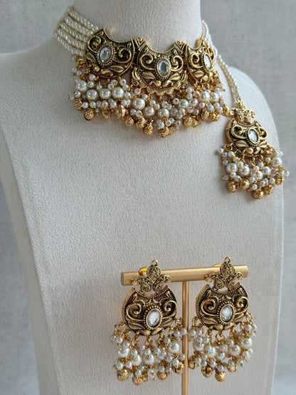 Ayura Designs Sneha Choker Set with Earrings & Tikka – Ivory Beads, Layered Pearl Detailing, Ghungroos & Antique Gold Finish
