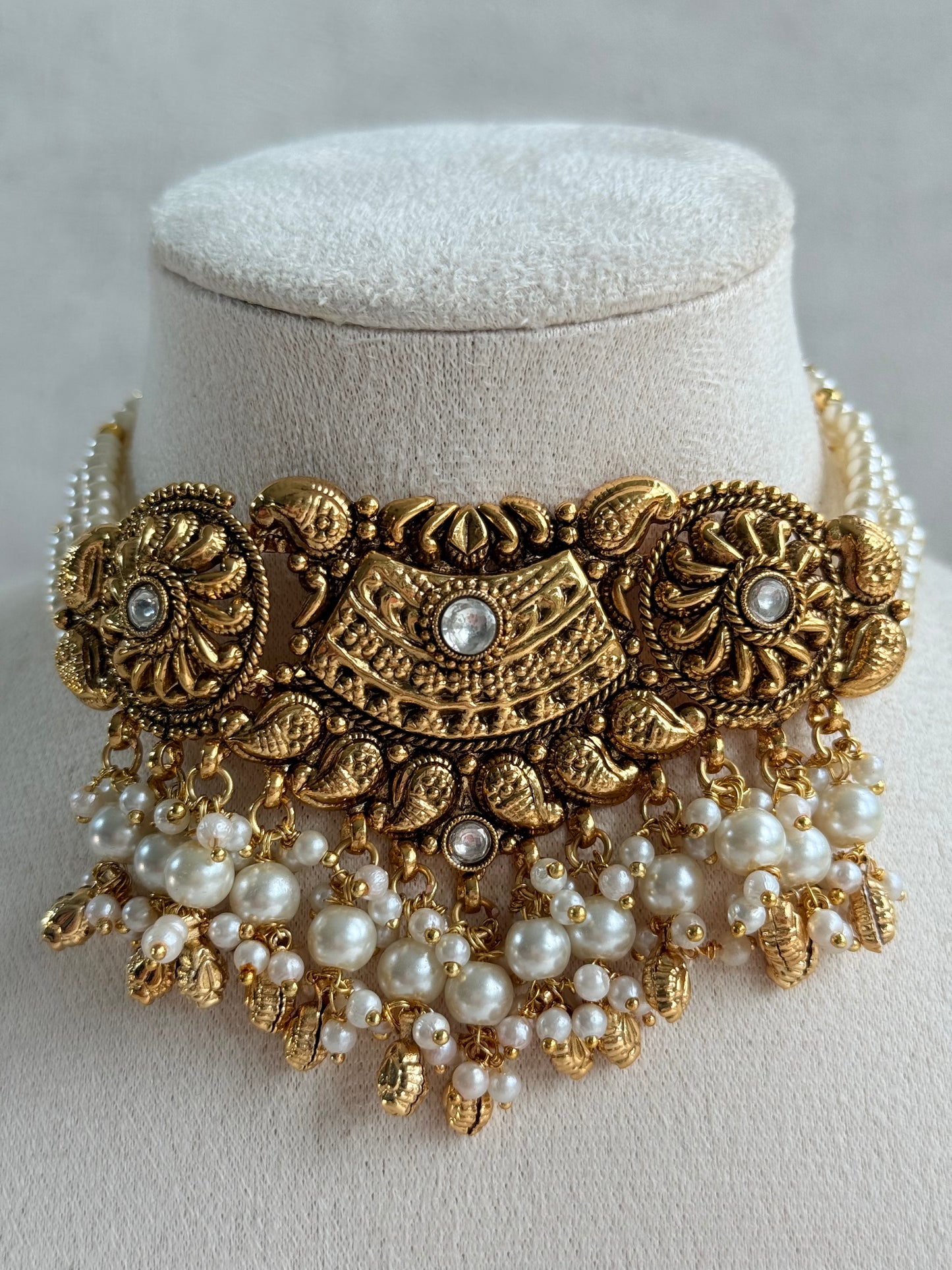 Ayura Designs Sairish Choker Set with Earrings & Tikka – Ivory Beads, Pearl Detailing, Ghungroos, Paisley Motifs & Antique Gold Finish