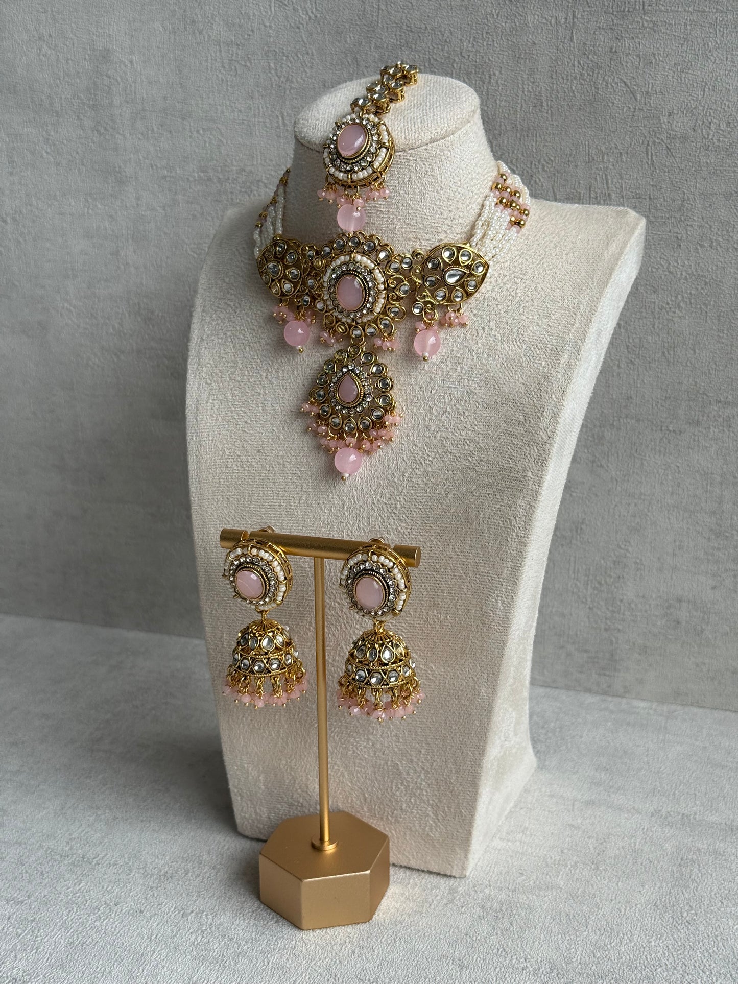 Ayura Designs Muskaan Set – Choker, Jhumkis & Tikka with Blush Pink Beads, Kundan Stones & Antique Gold Finish